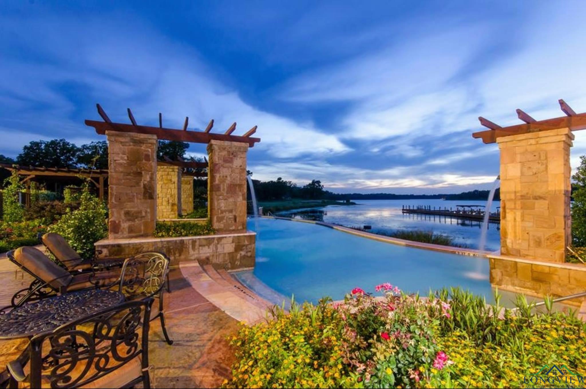 Image 2: View of pool with a water view, Community Pool