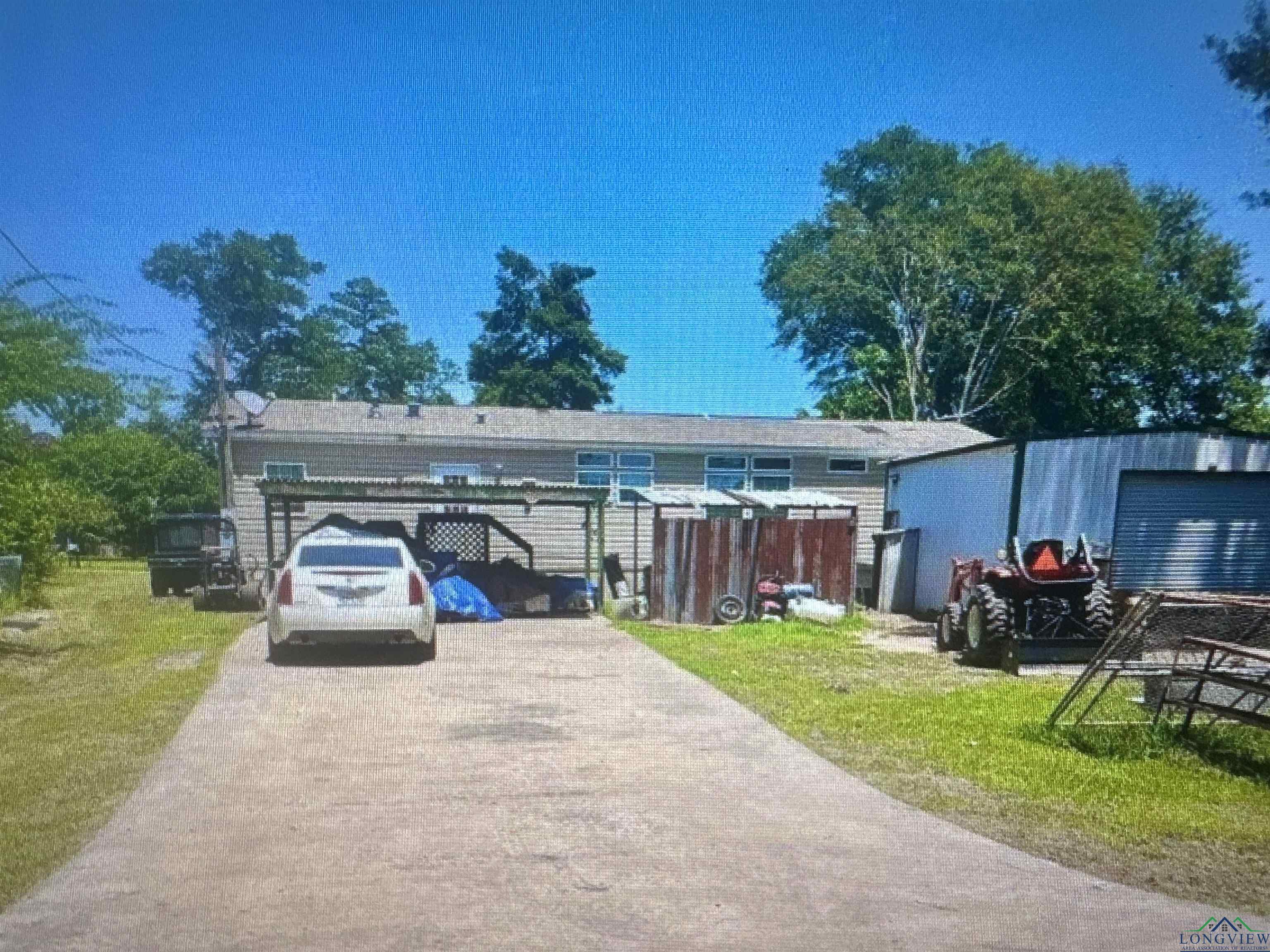 Image 3: View of rear of house with a front yard, Back of structure