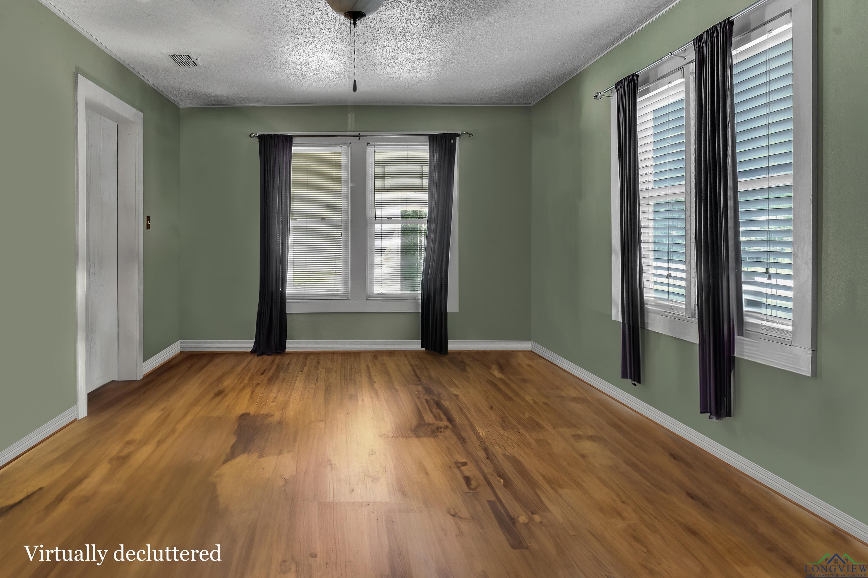 Image 4: Empty room with wood finished floors, a textured ceiling, and ornamental molding, Other