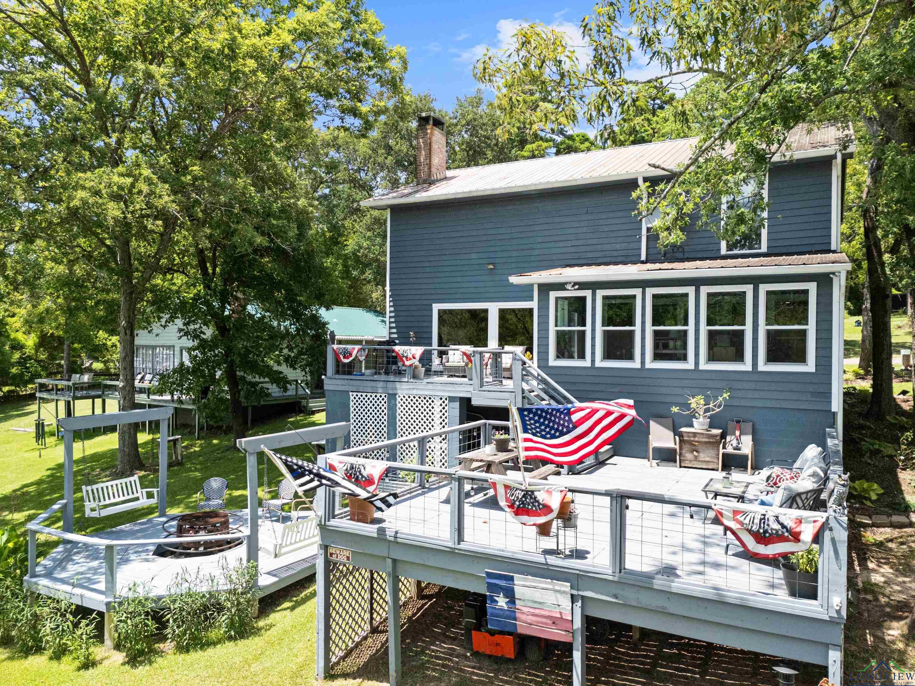 Image 0: Rear view of house, Home facing Lake