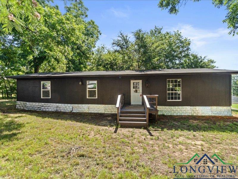 Image 0: Home featuring a front lawn, Front Of Structure
