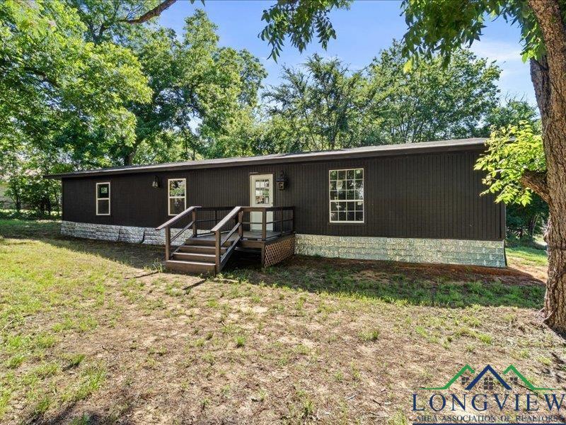 Image 1: Home featuring a front yard, Front Of Structure
