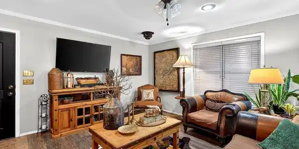 Image 1: Living room featuring wood finished floors, crown molding, and a ceiling fan, Main Living Room