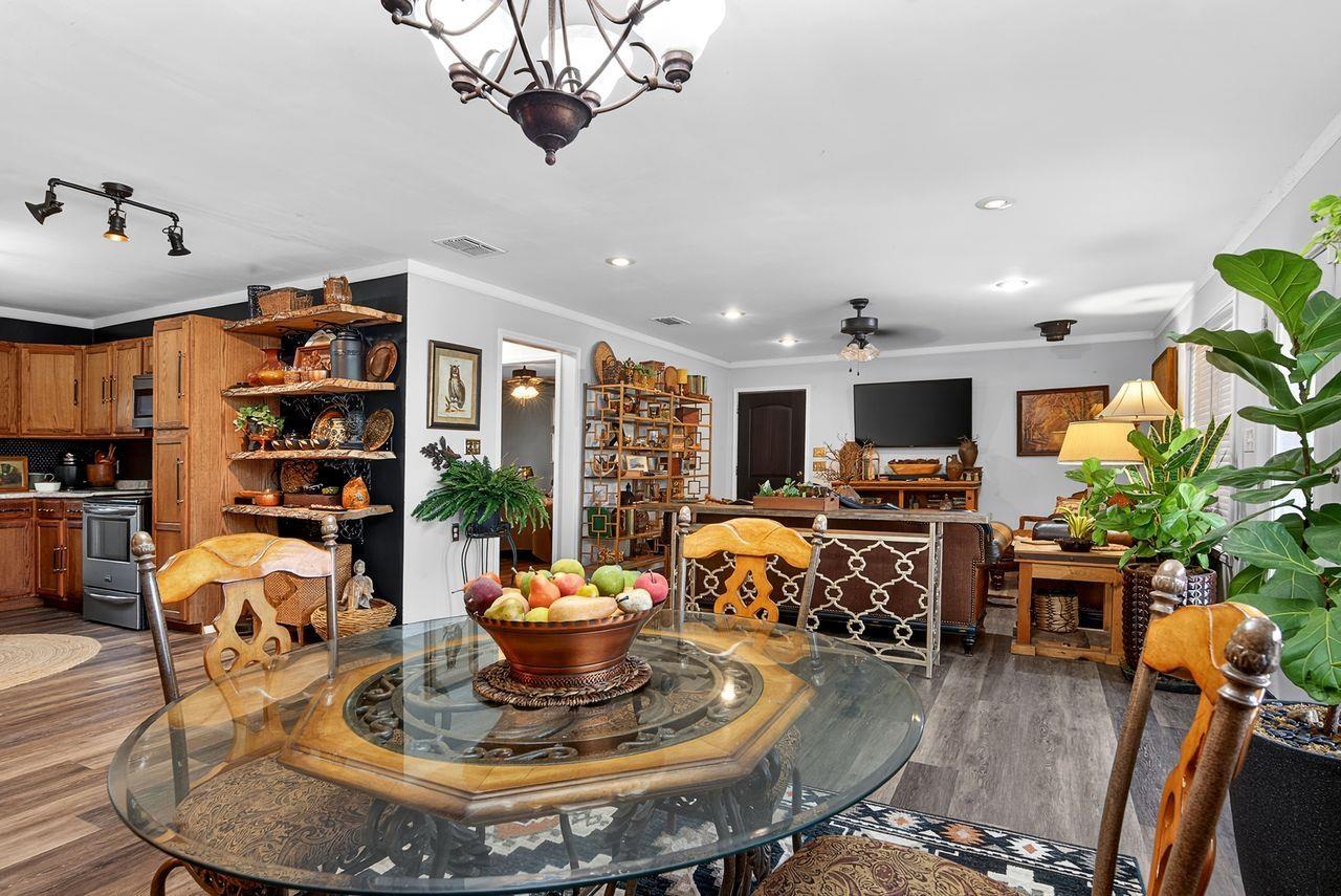 Image 3: Dining space featuring crown molding, ceiling fan, dark wood finished floors, and recessed lighting, Dining Area