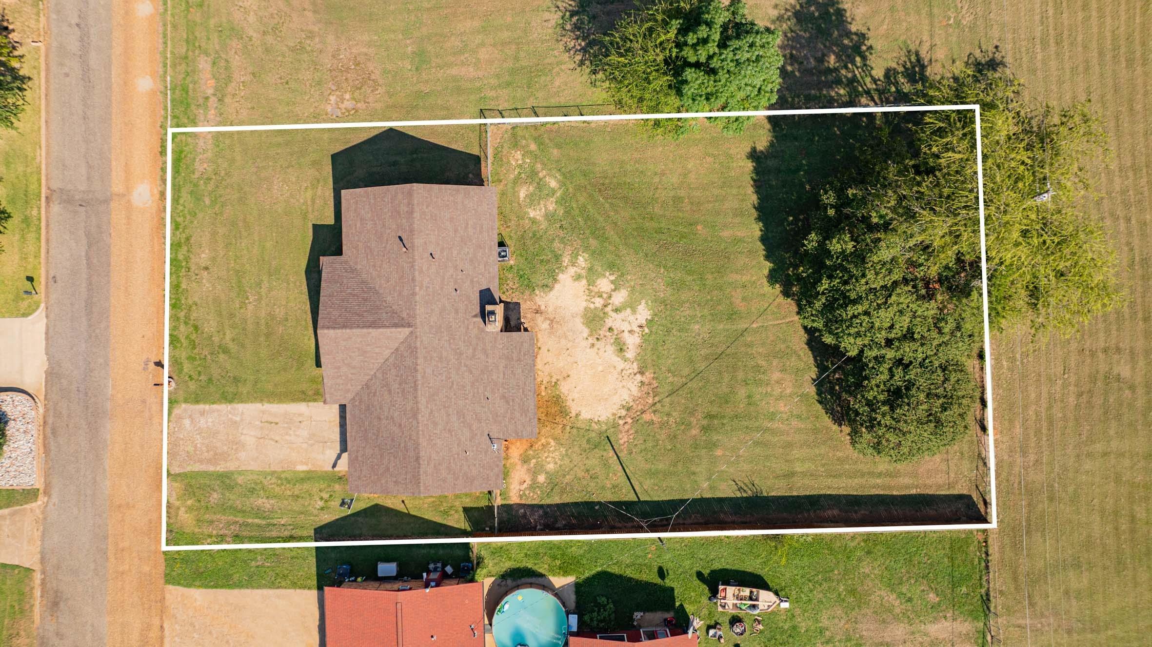 Image 2: Aerial overview of property's location featuring property parcel outlined, Aerial View