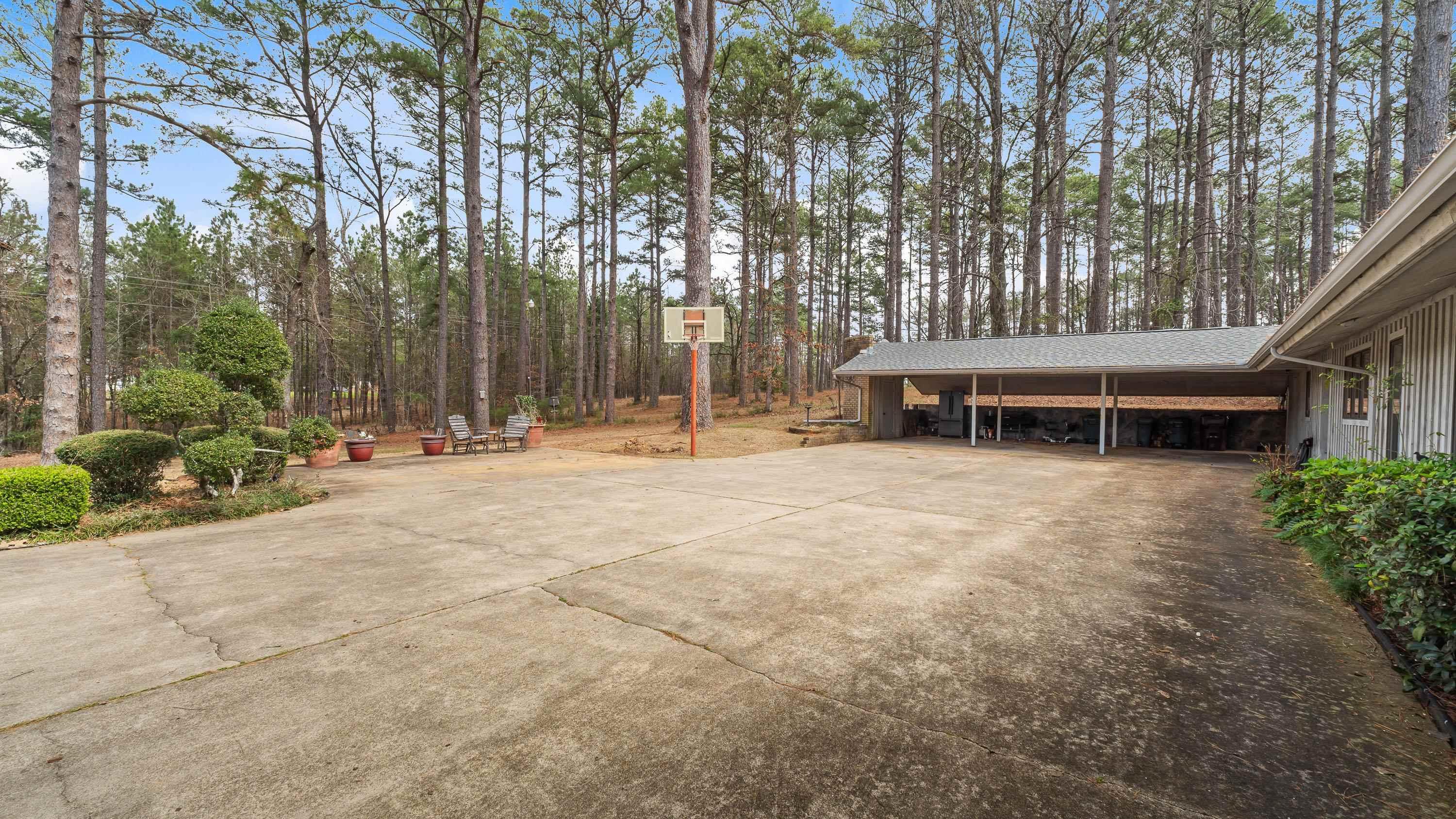 Image 2: View of patio / terrace with an attached carport and driveway, Patio