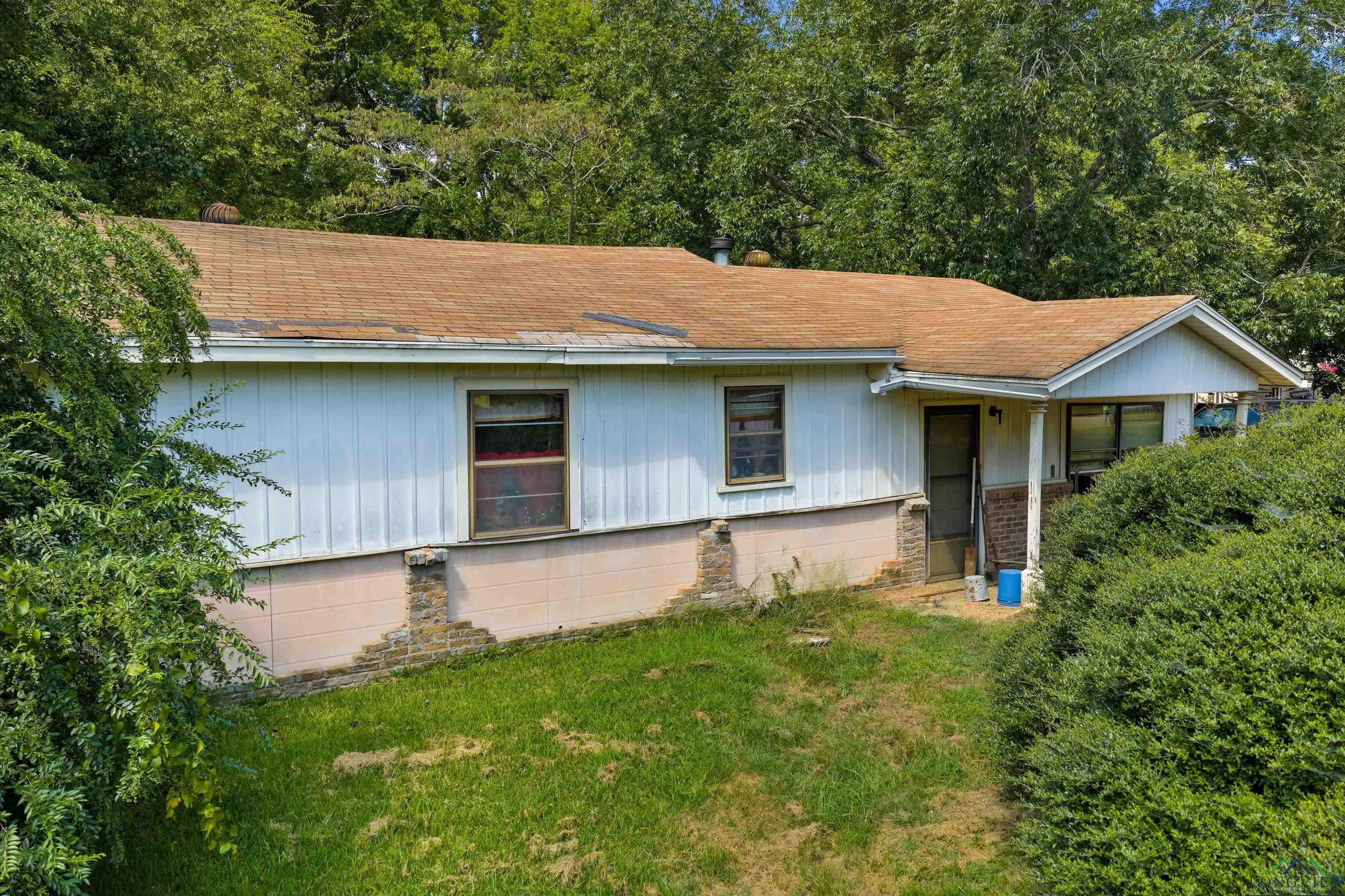 Image 0: Single story home with a front yard and a shingled roof, Front Of Structure