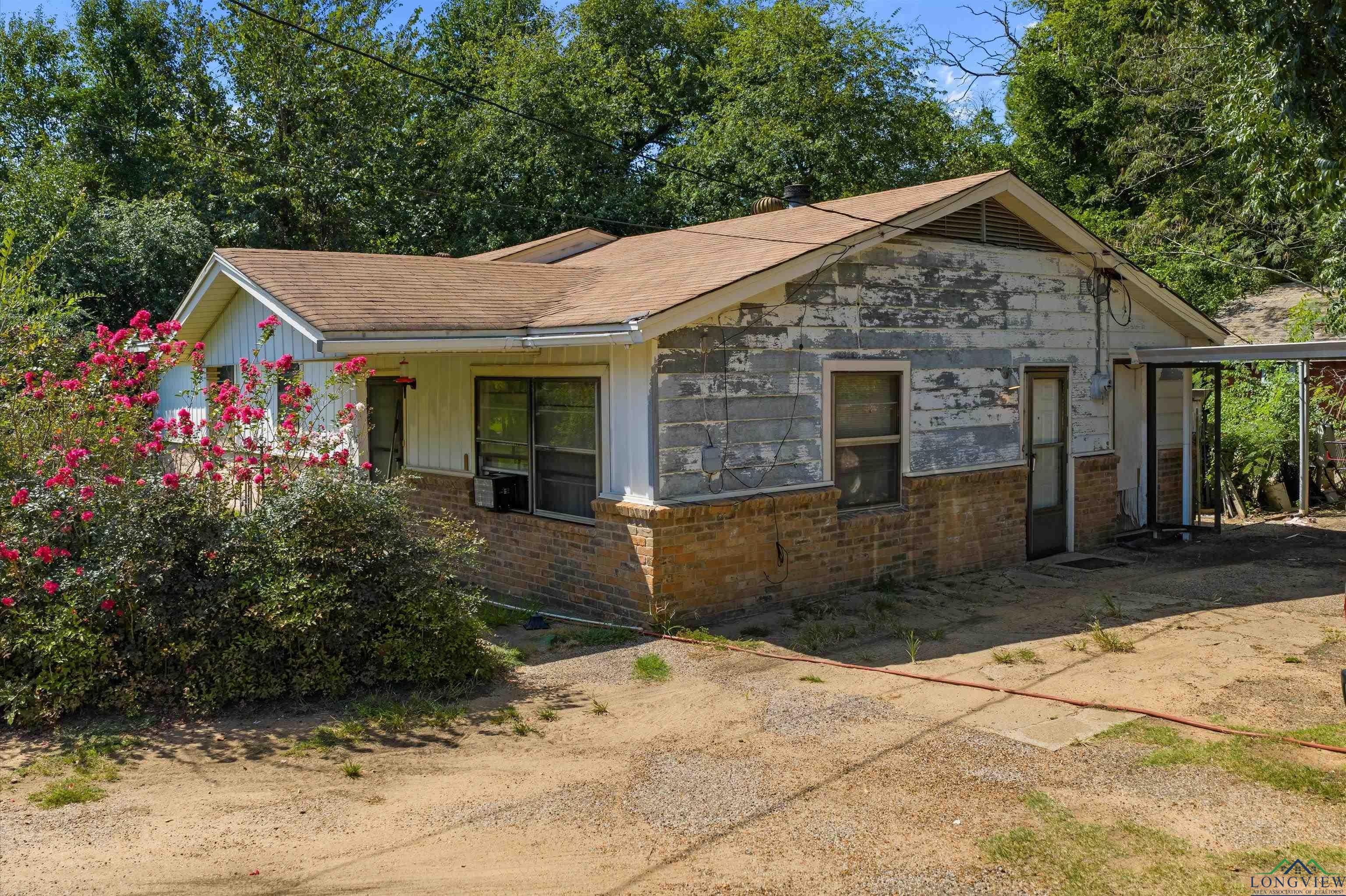 Image 2: View of front of house with brick siding, Front Of Structure