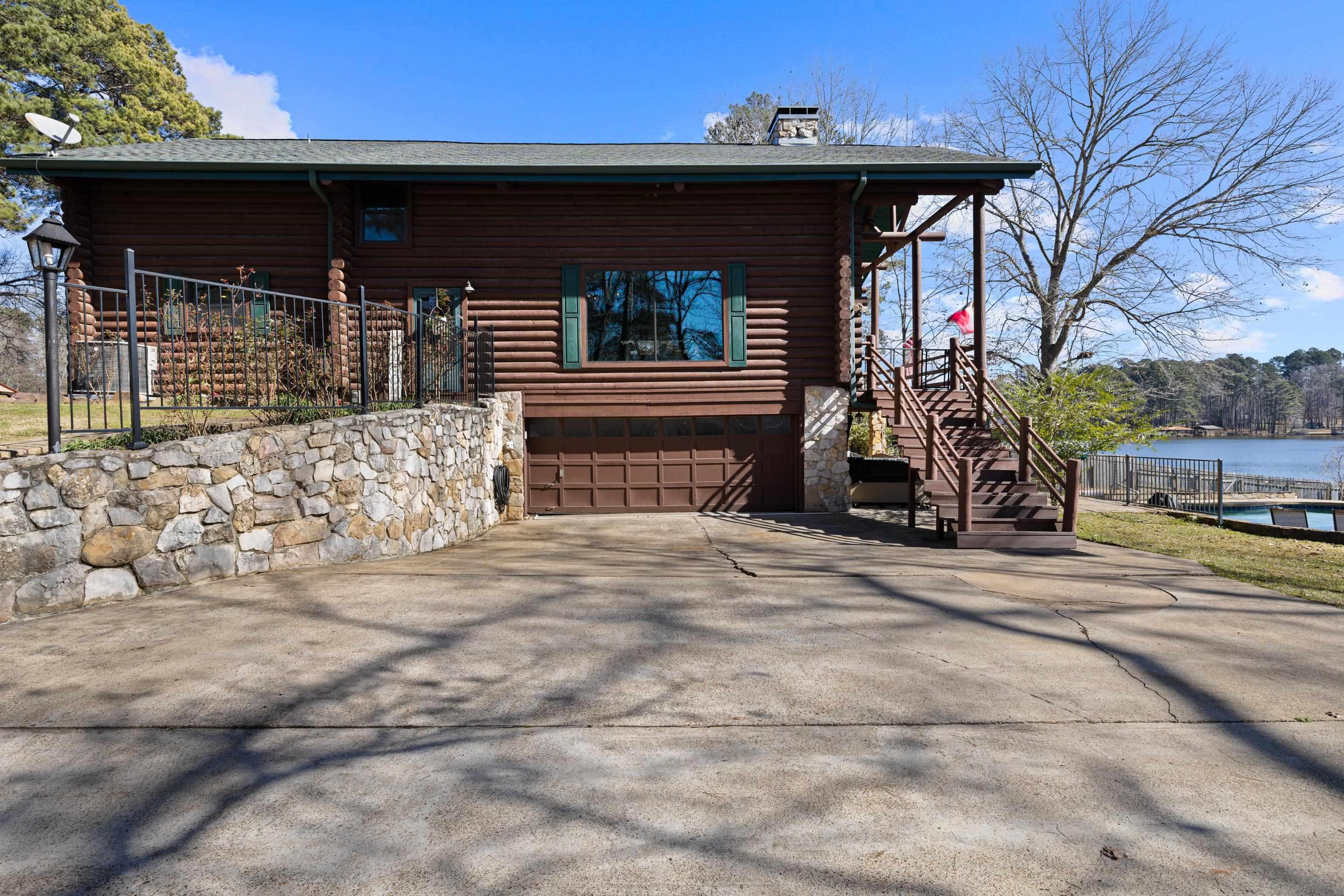 Image 2: Side of House/Garage View