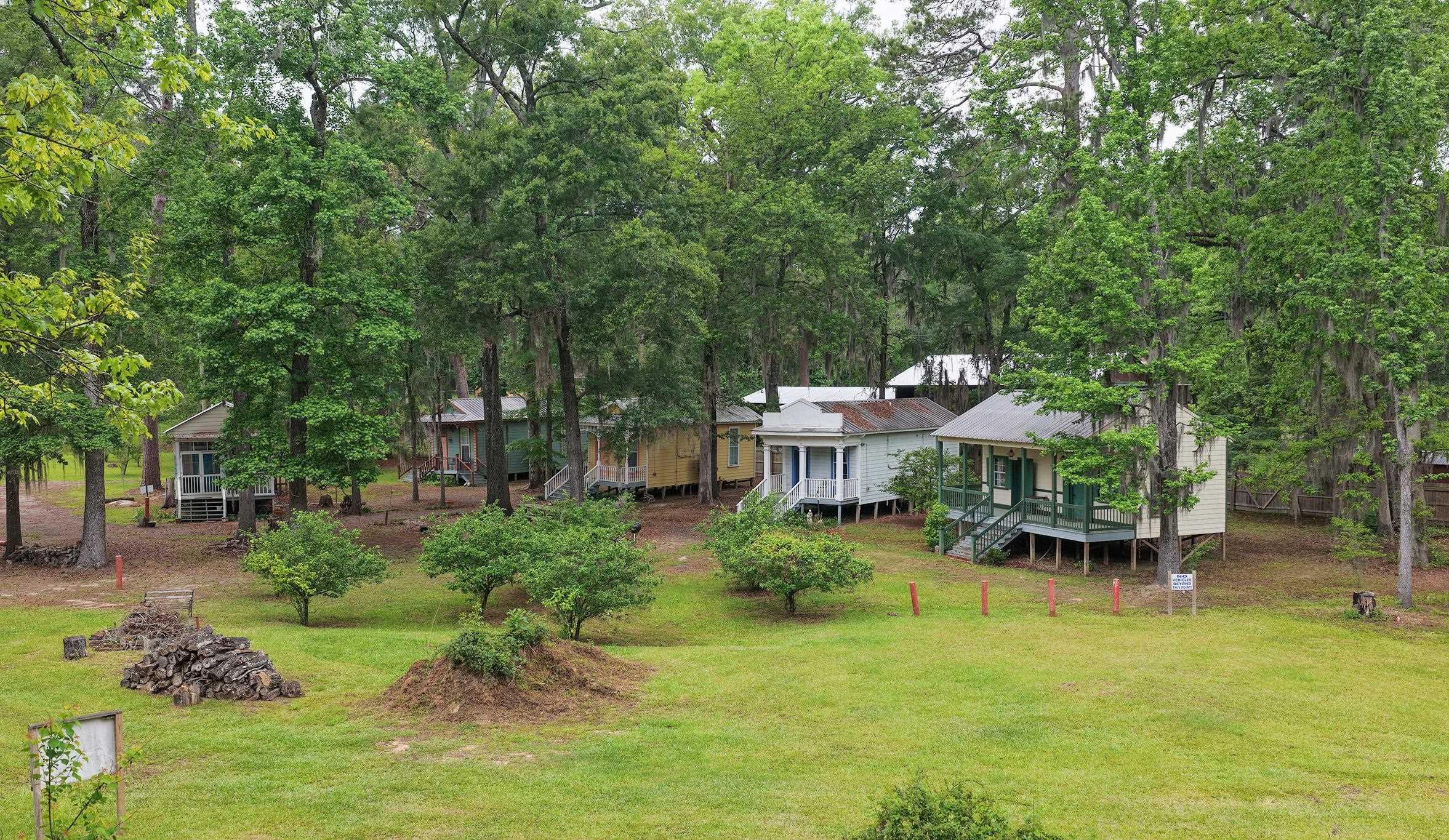 Image 0: Several traditional-style cottages on elevated foundations, each featuring a porch entry, Bed & Breakfast