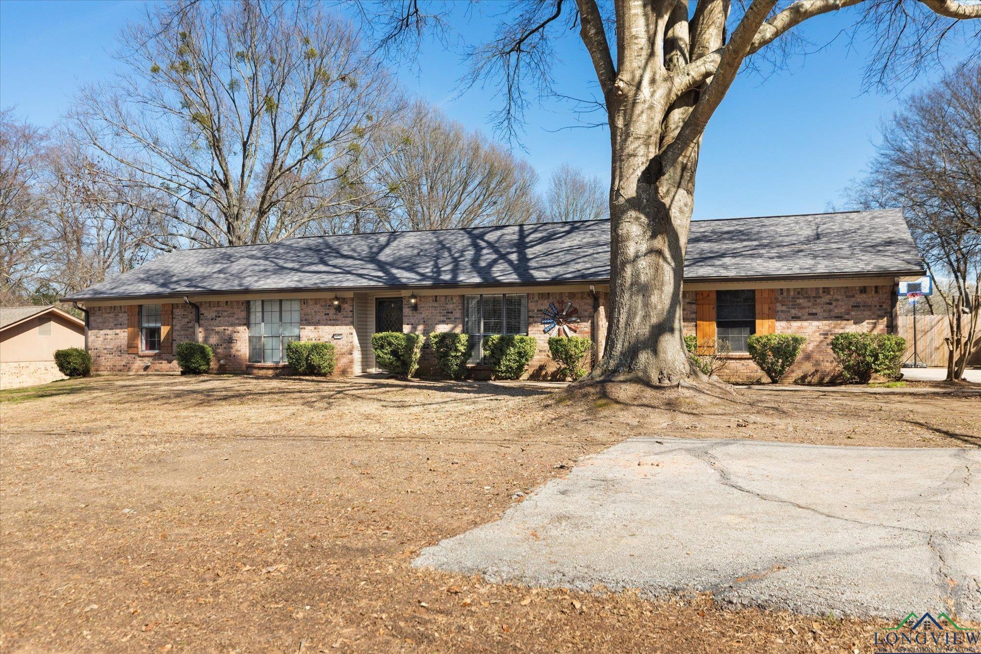 Image 2: Ranch-style home featuring brick siding, Front Of Structure