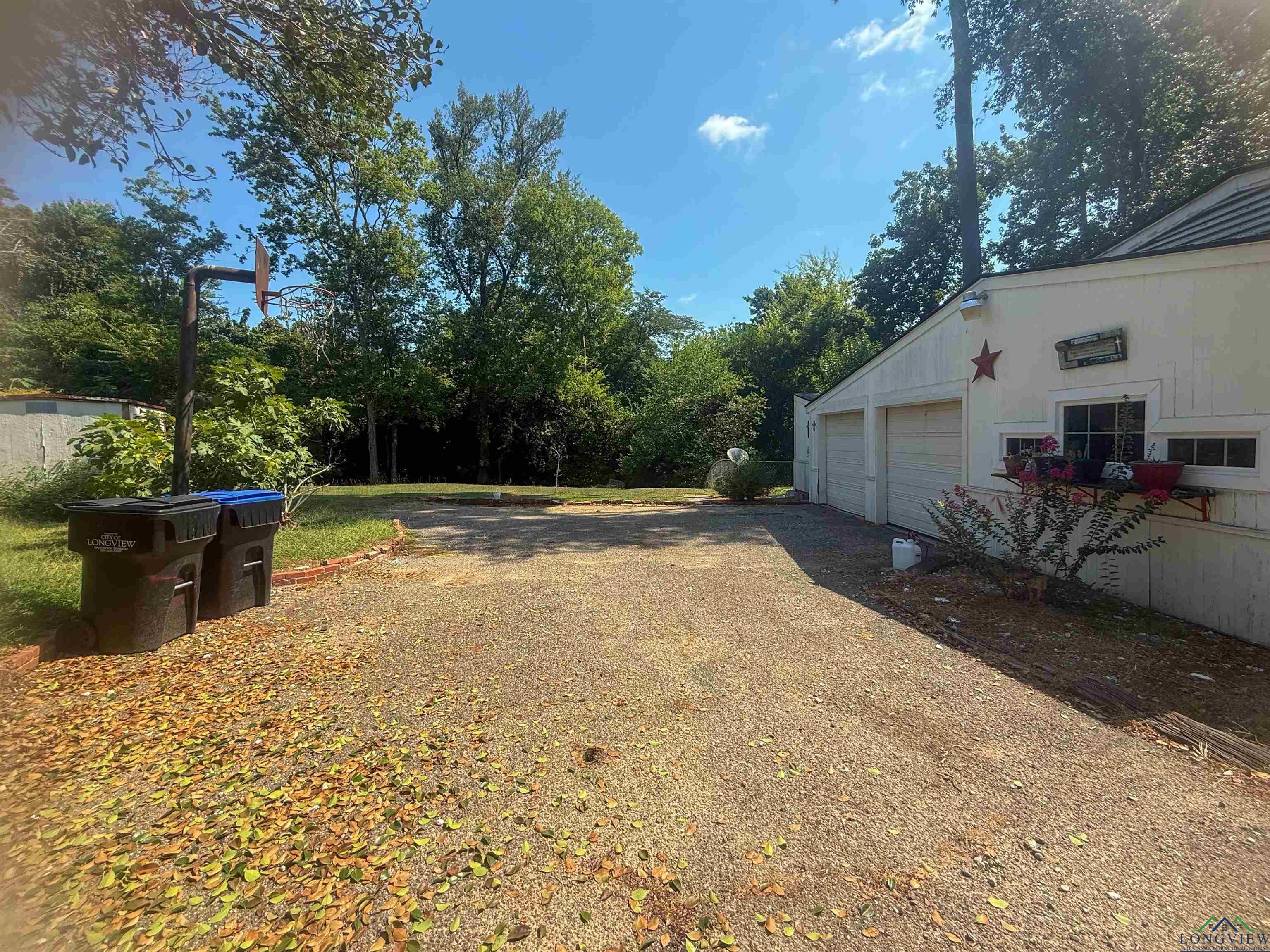 Image 3: View of yard with a garage, Yard