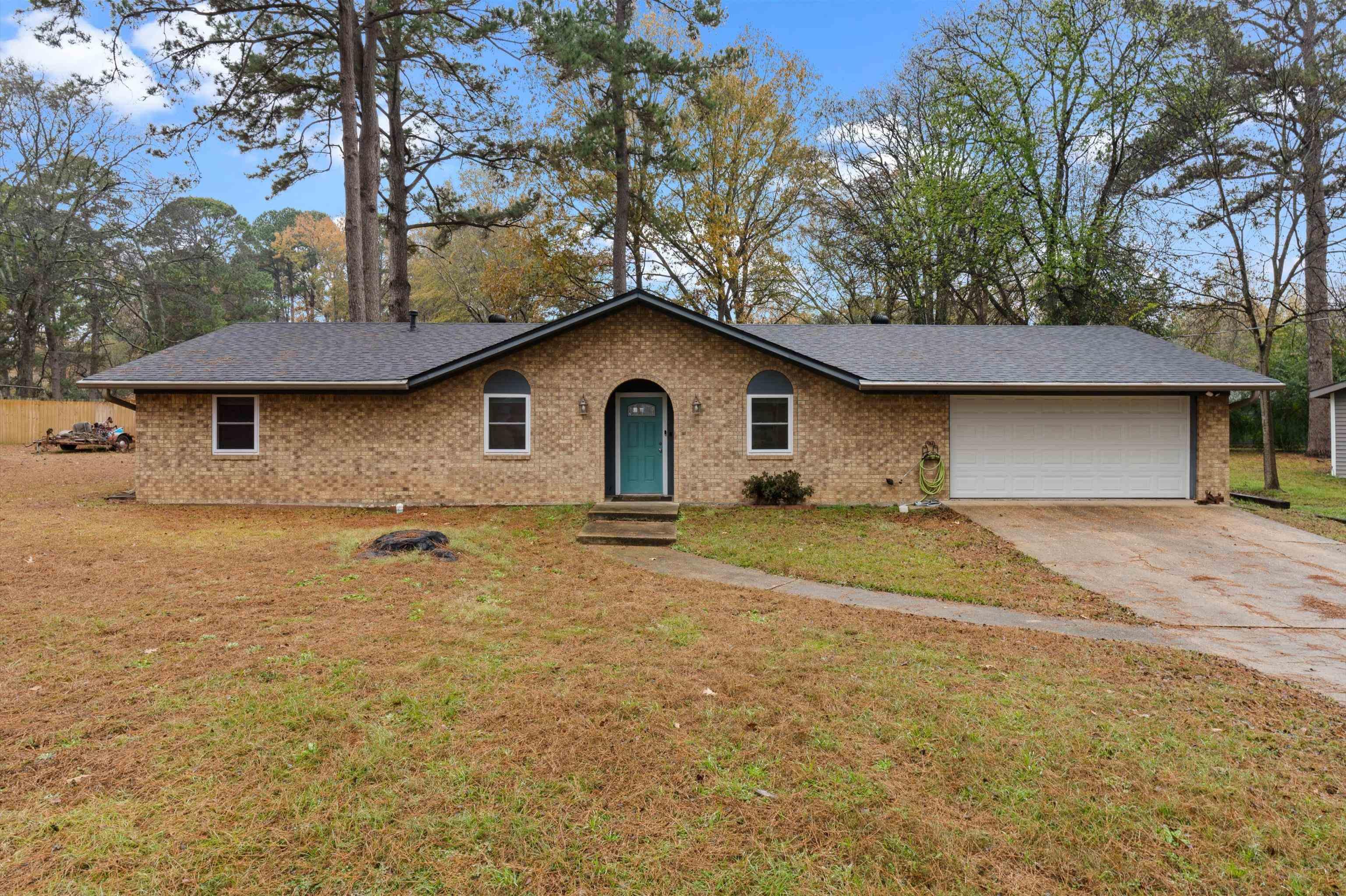 Image 0: Ranch-style home featuring driveway, a front yard, and brick siding, Front Of Structure