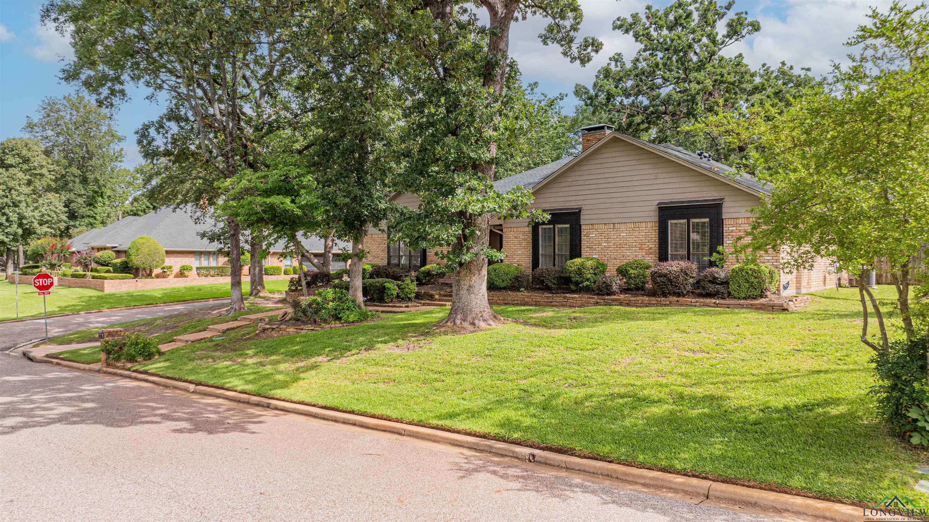 Image 0: View of front facade with a front yard, a chimney, and brick siding, Front Of Structure