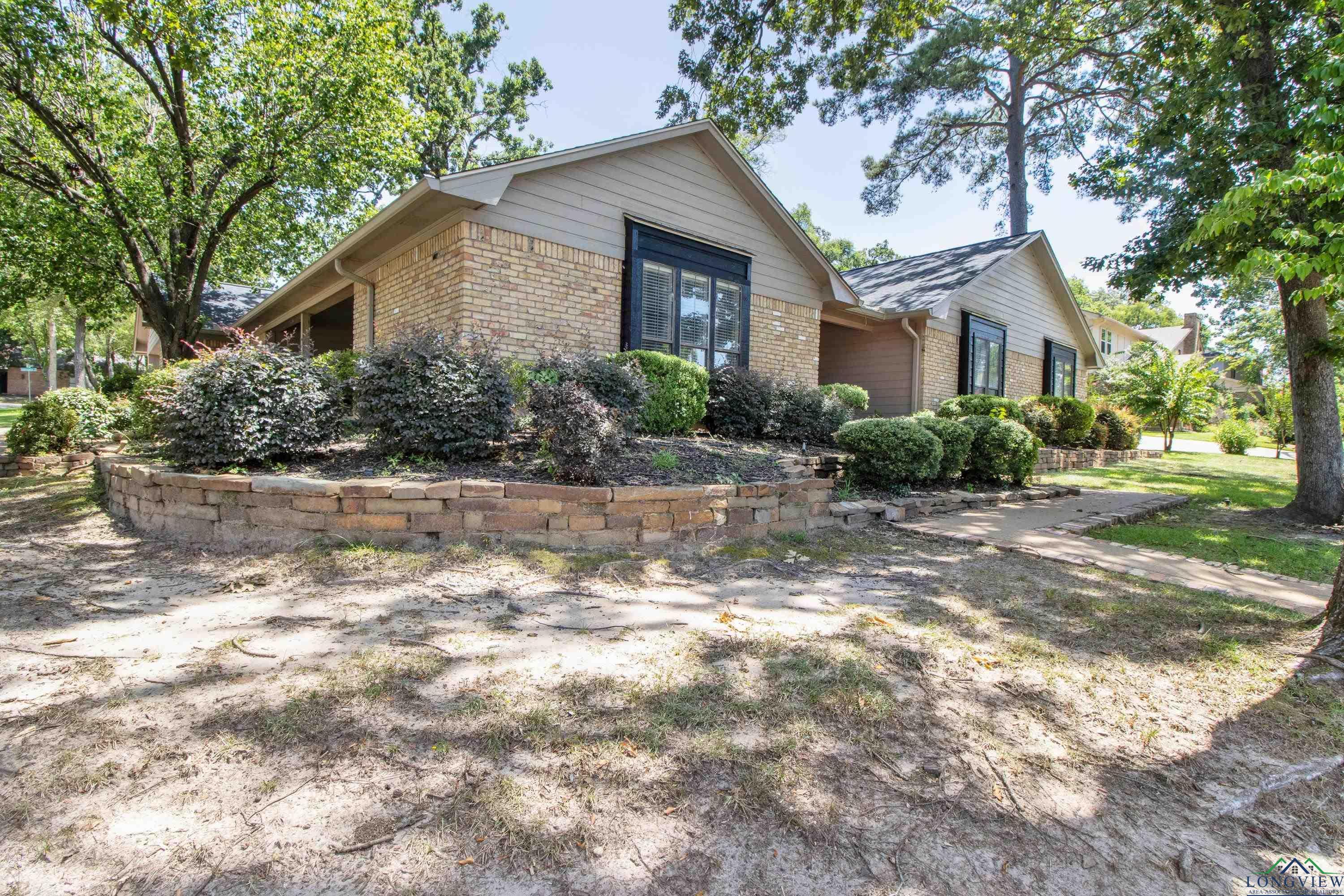 Image 1: View of property exterior with brick siding, Side Of Structure
