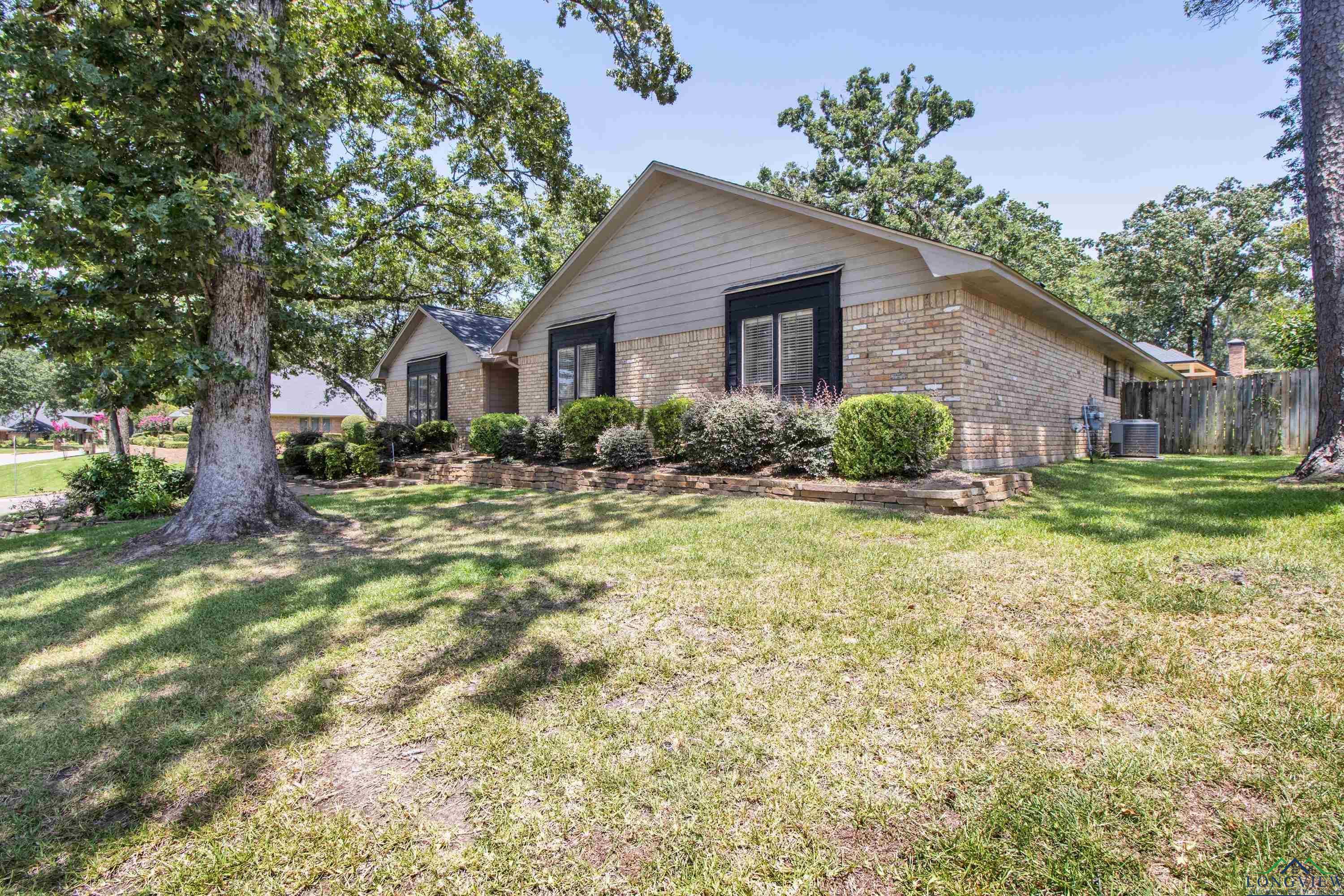 Image 3: Ranch-style house with brick siding, Front Of Structure