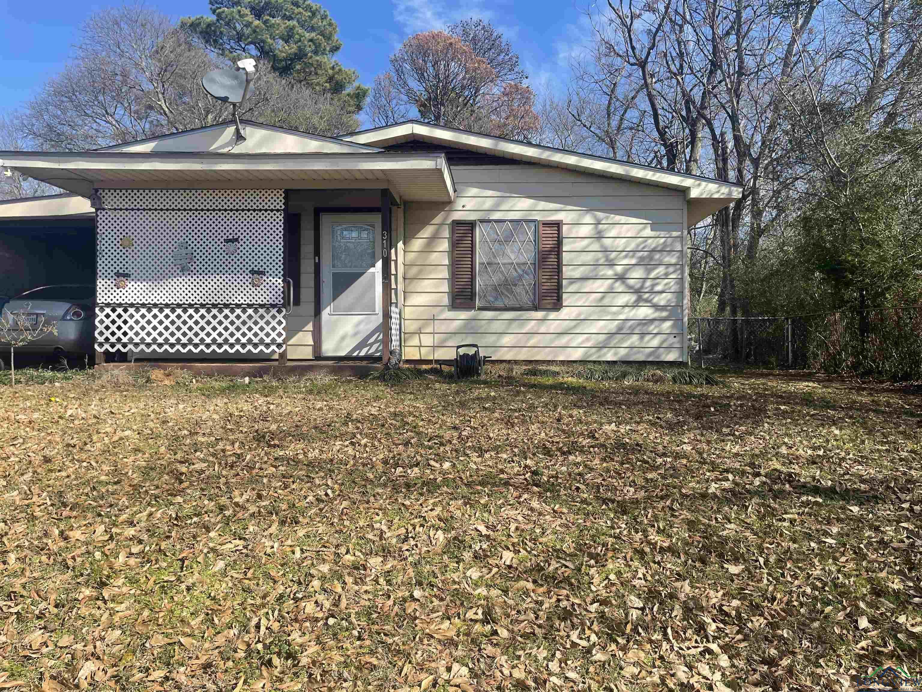 Image 0: View of front of property with a carport, Front Of Structure