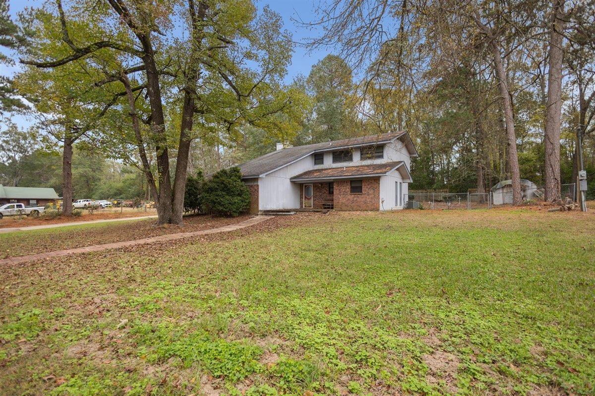 Image 0: View of front of house featuring brick siding, Front Of Structure