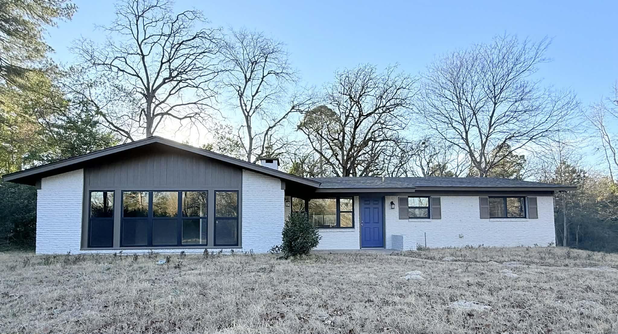 Image 0: View of front of property featuring brick siding, Front Of Structure