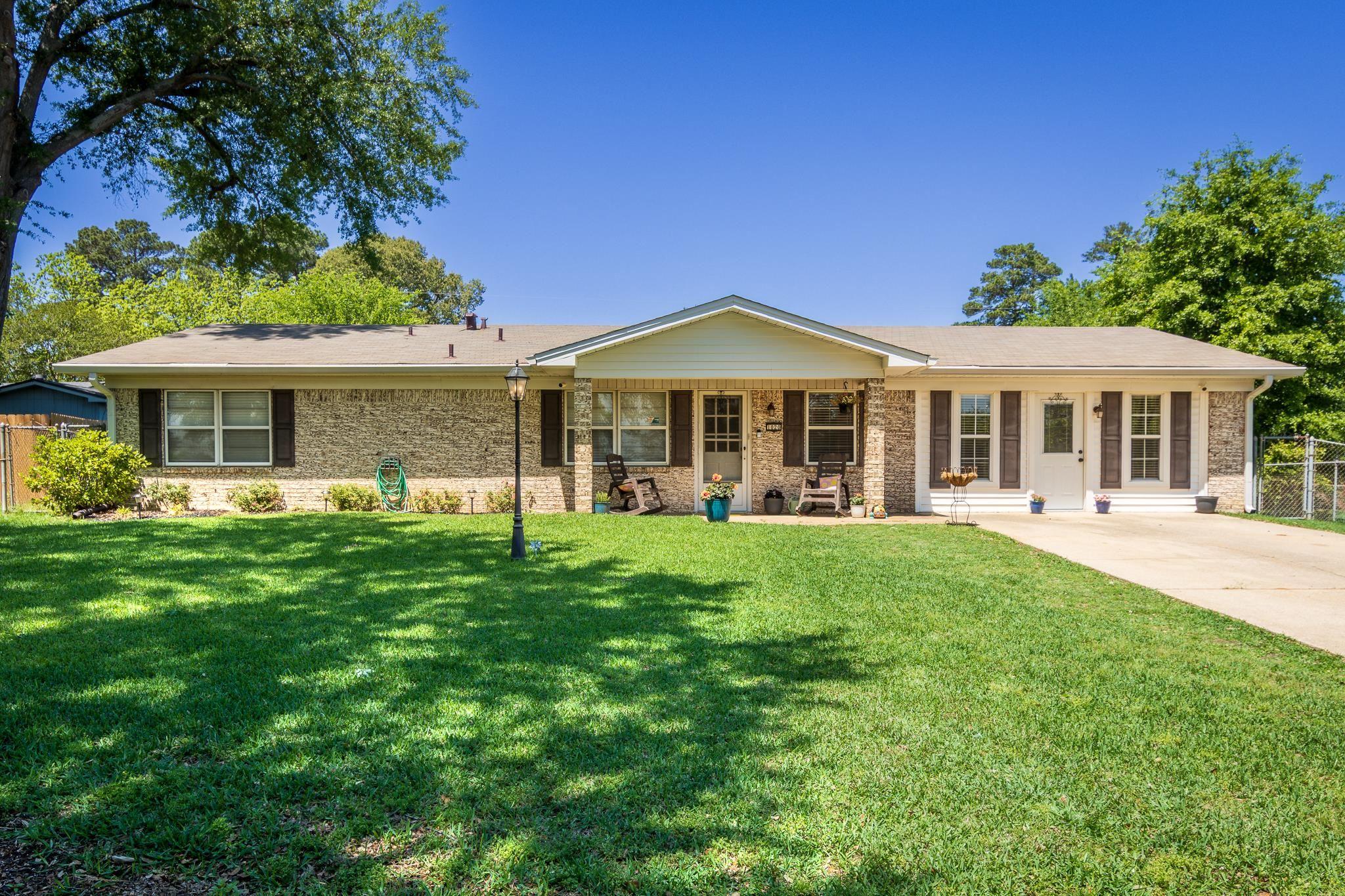 Image 0: Ranch-style exterior with brick siding and a covered front entry, Front Of Structure
