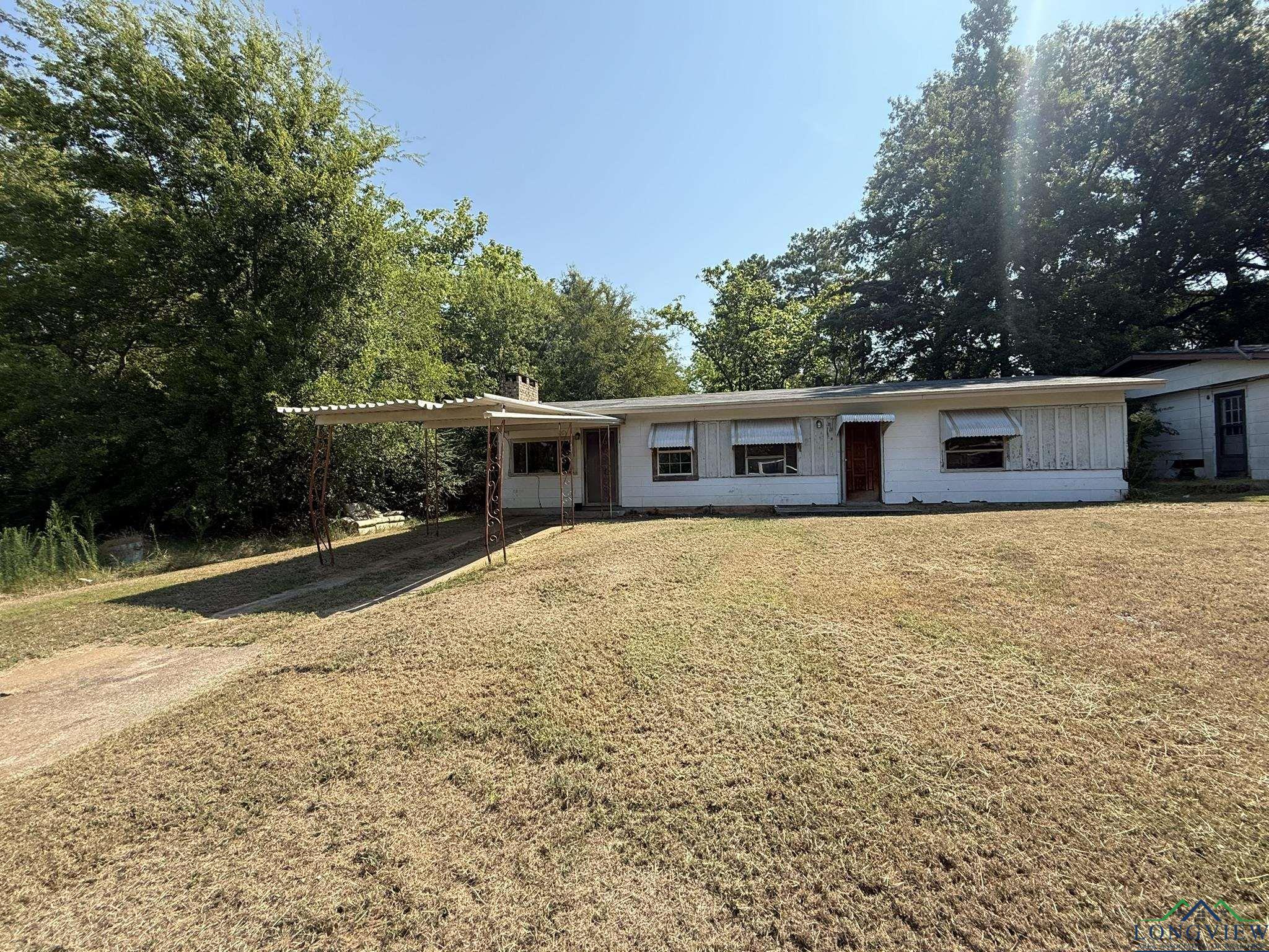 Image 0: Ranch-style home with a front lawn and a chimney, Front Of Structure