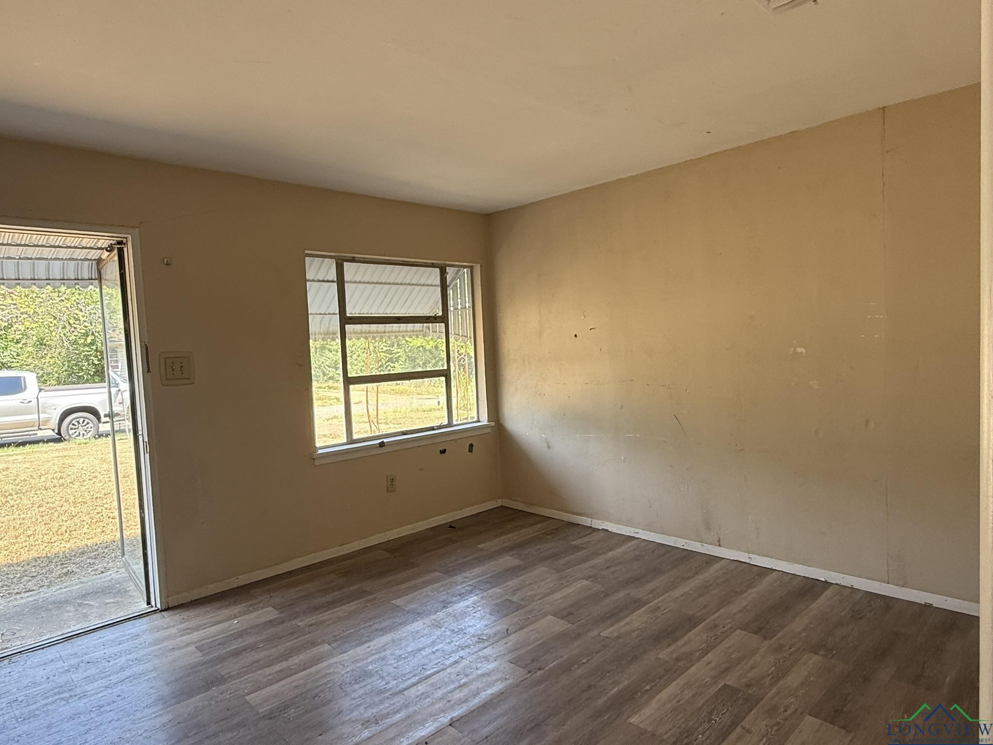 Image 1: Unfurnished room with dark wood-style flooring and baseboards, Other