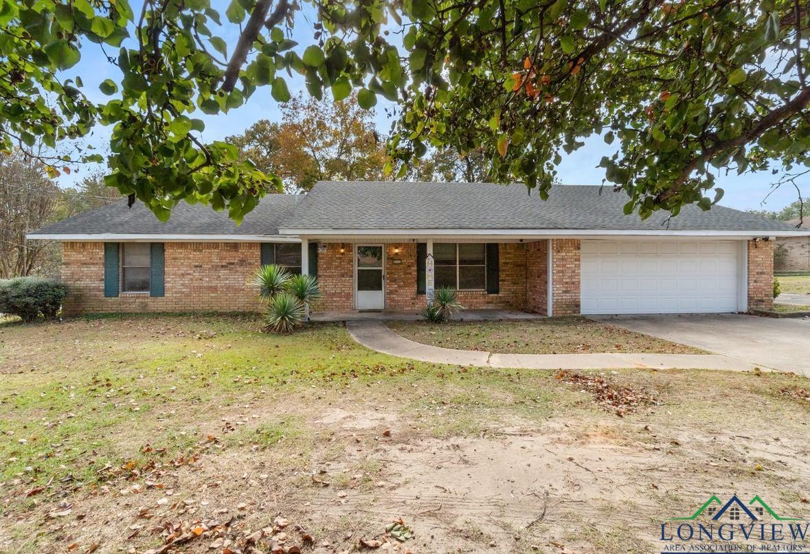Image 0: Ranch-style home with covered porch, brick siding, concrete driveway, and roof with shingles, Front Of Structure