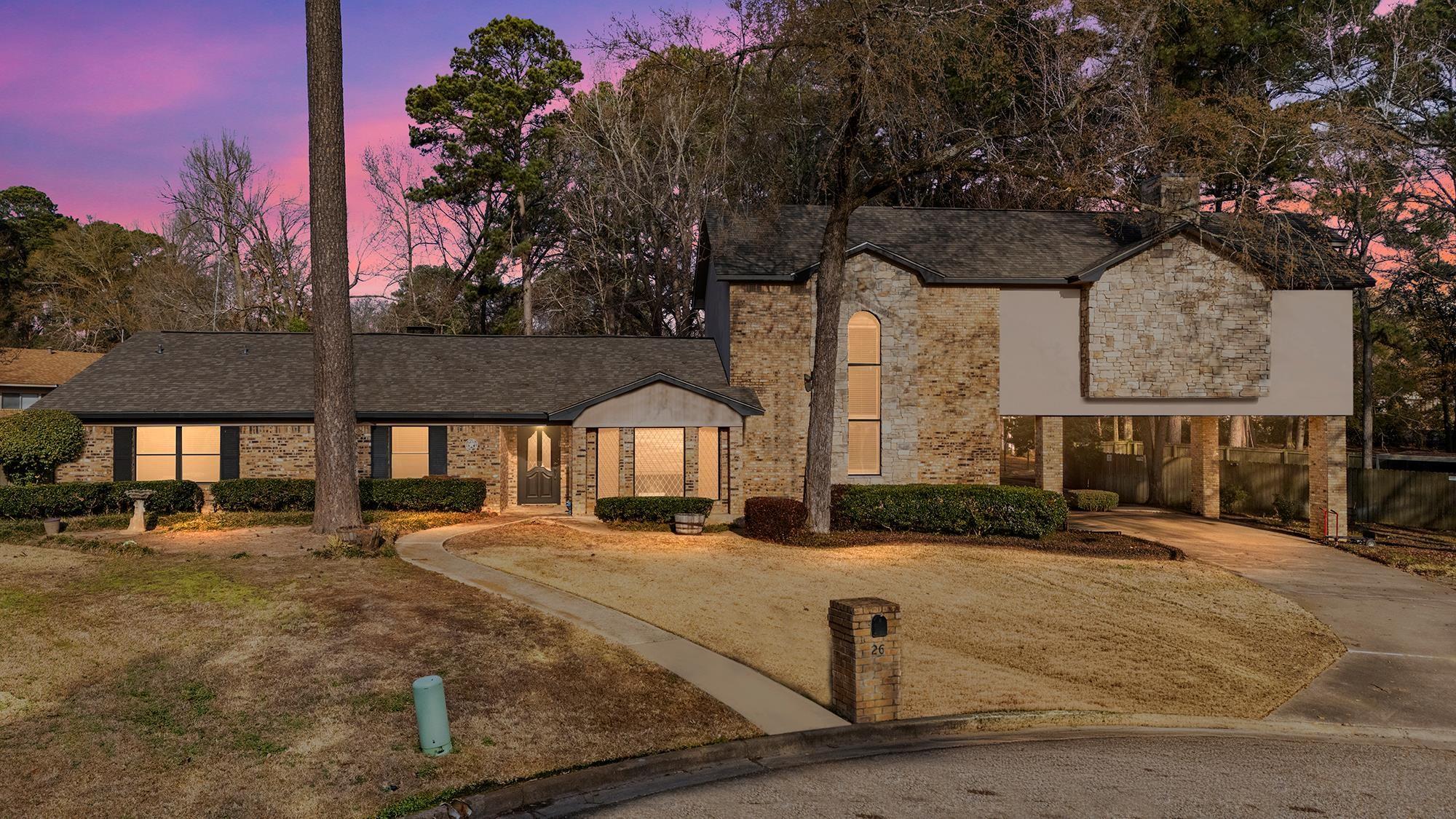 Image 0: View of front of property with driveway and brick siding, Front Of Structure