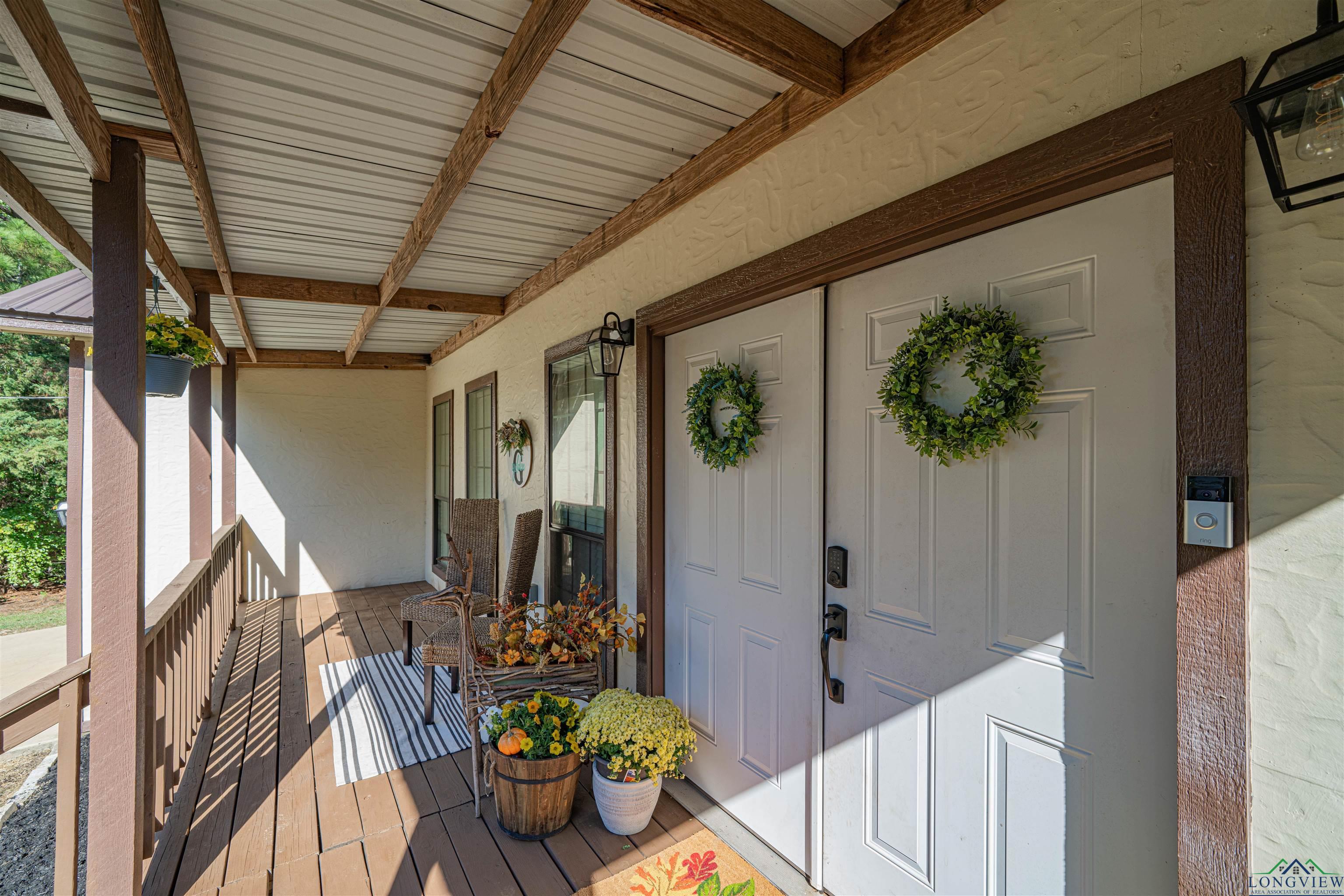 Image 2: Property entrance with covered porch, Entry