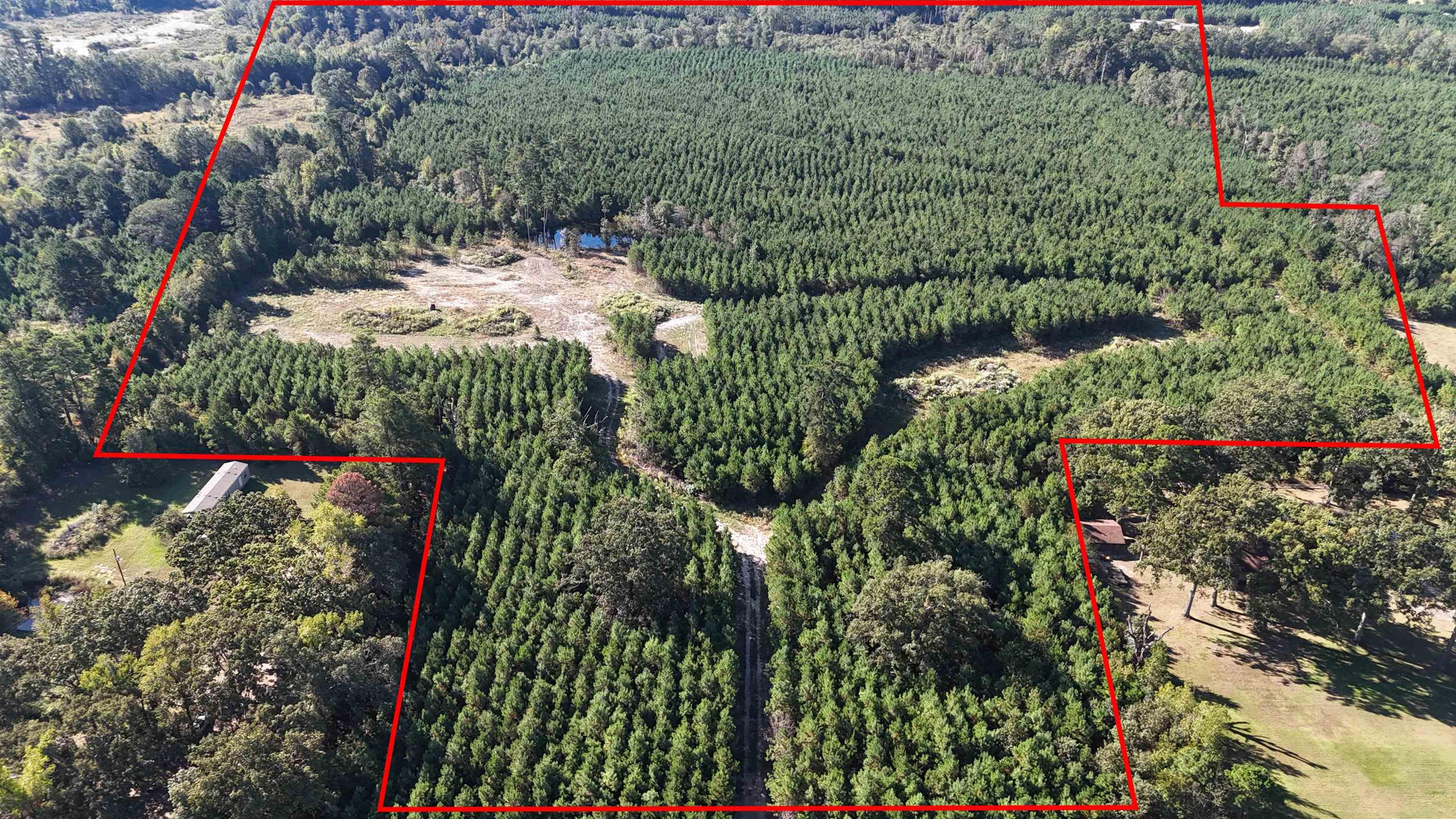 Image 2: Aerial overview of property's location featuring property parcel outlined, Aerial View