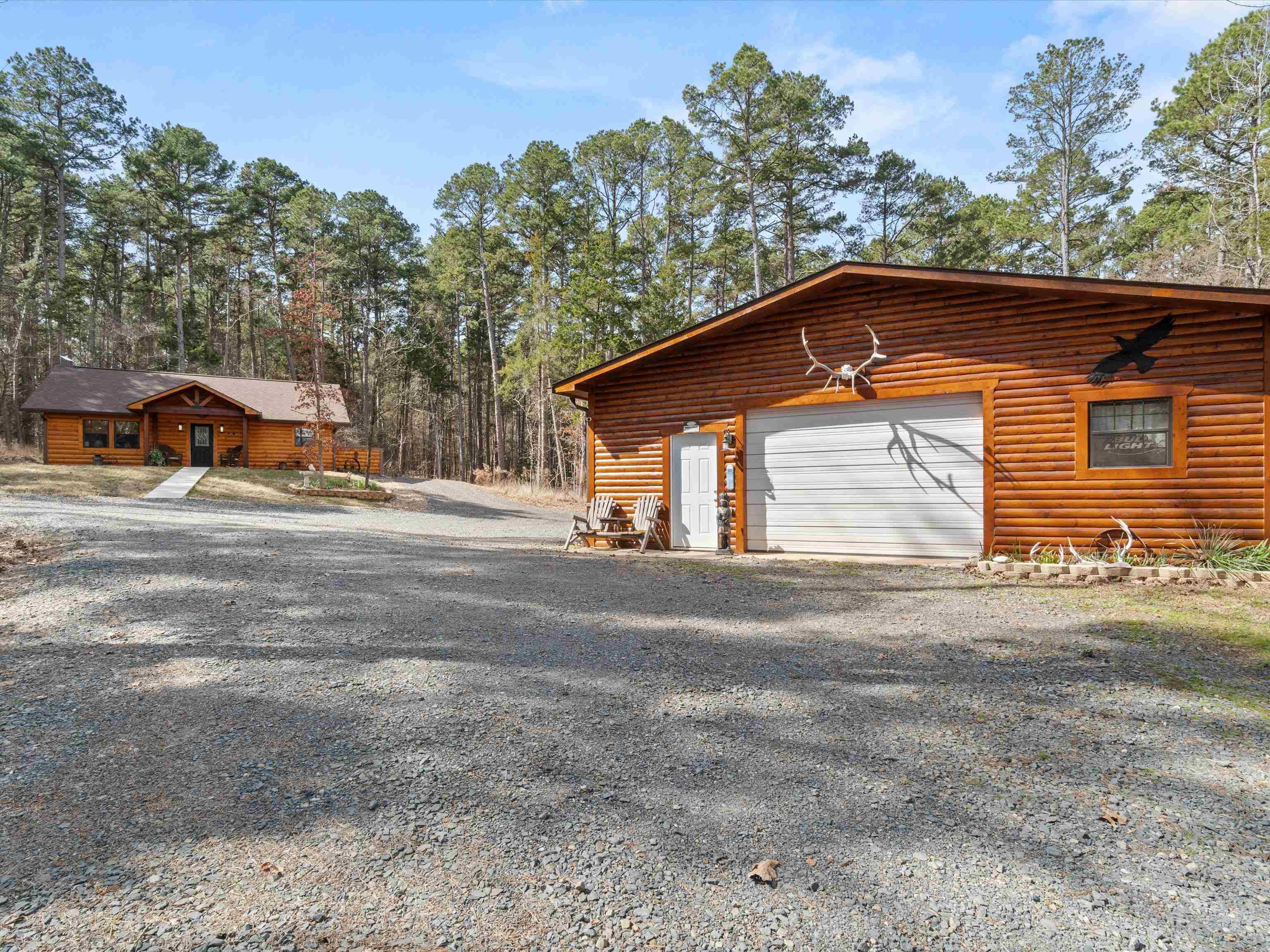Image 0: Garage with gravel driveway, Garage