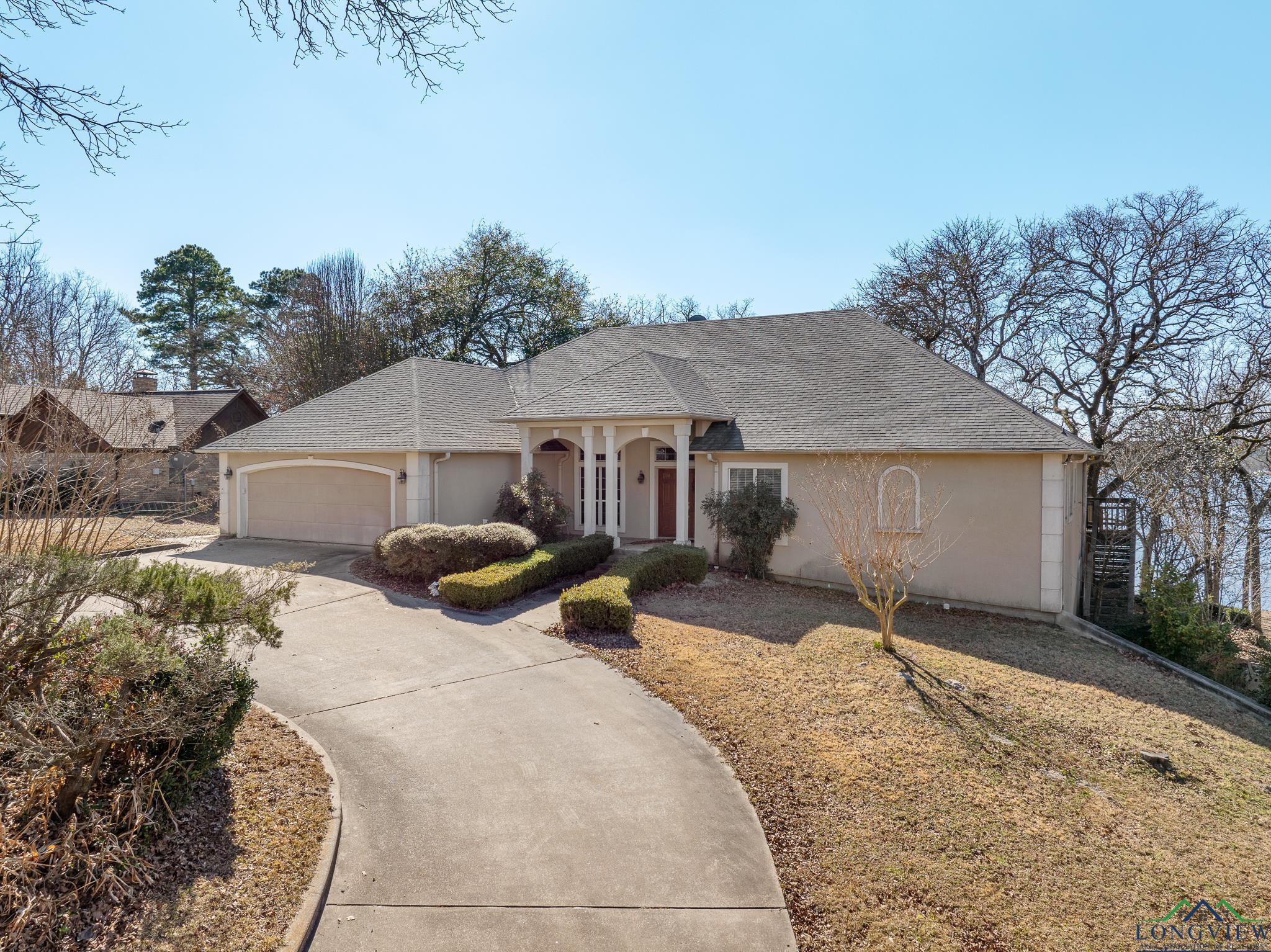 Image 1: View of front of home with a garage, Front Of Structure