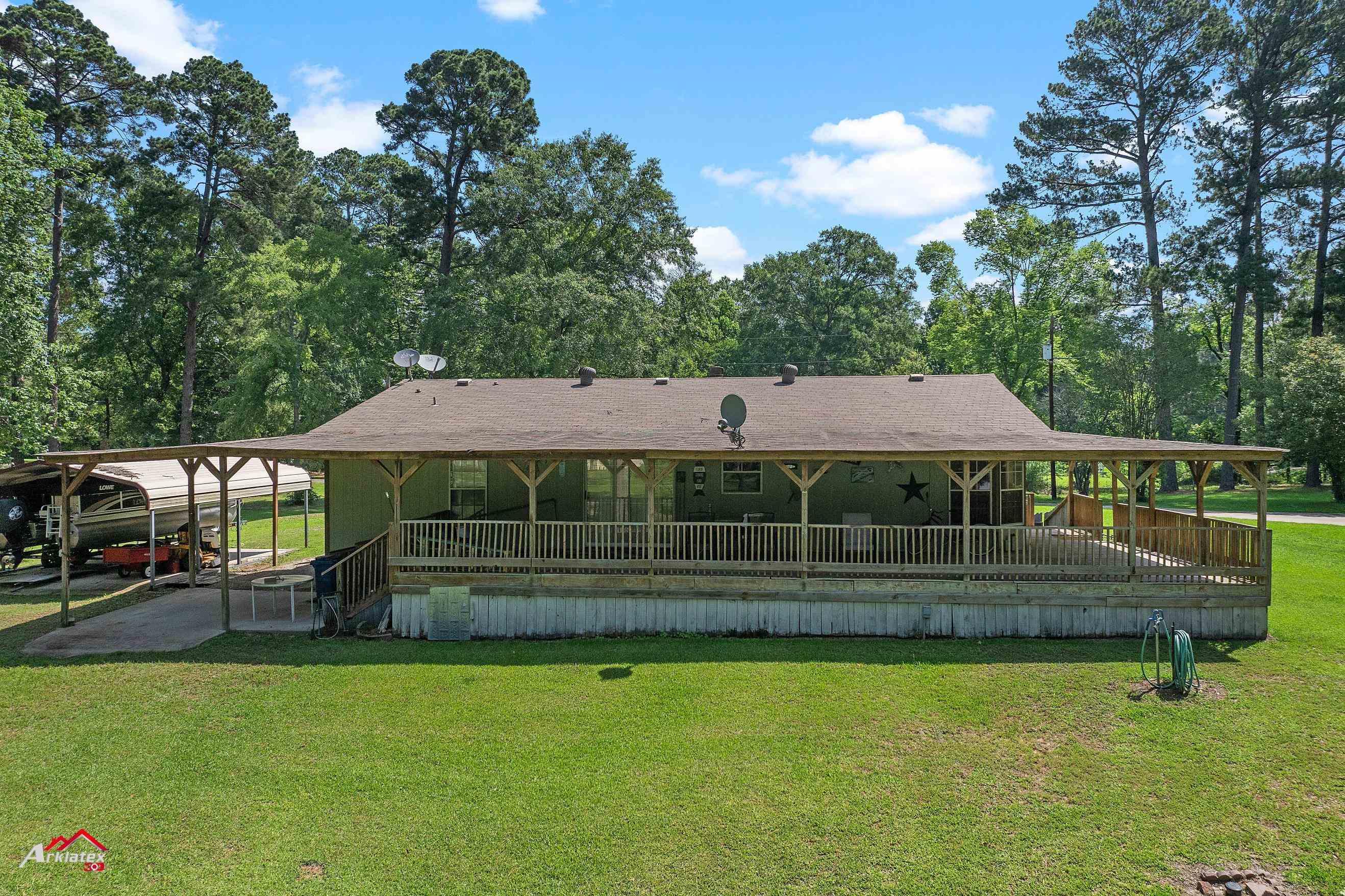 Image 1: Back of property featuring a yard, Back Of Structure