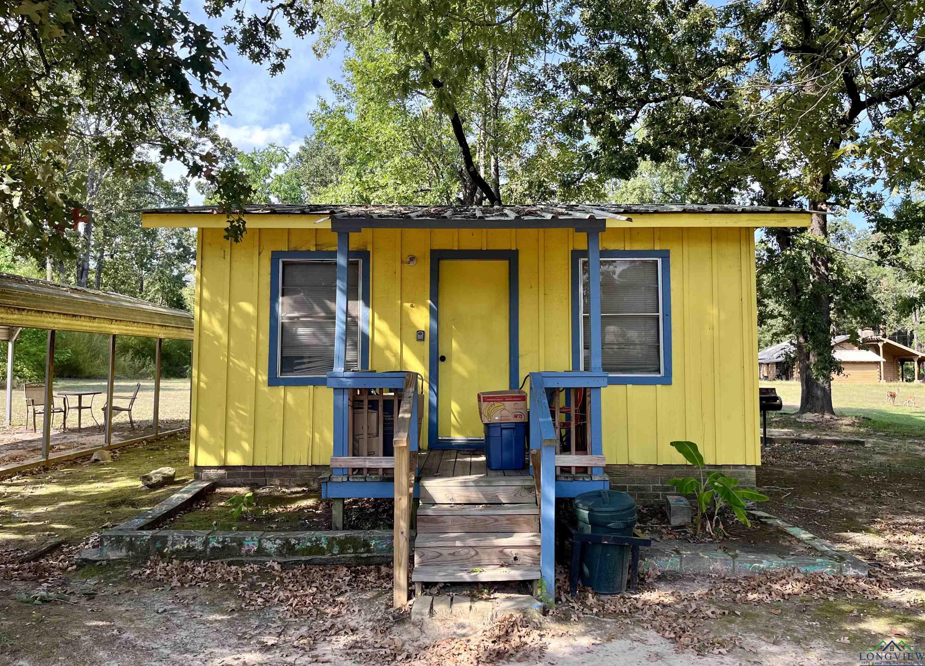 Image 2: View of front of house featuring crawl space, Cabin #4