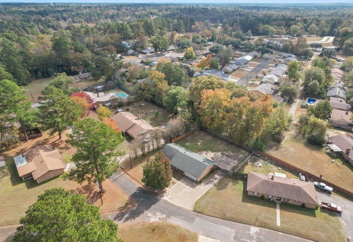 Image 2: Aerial overview of property's location with nearby suburban area, Aerial View