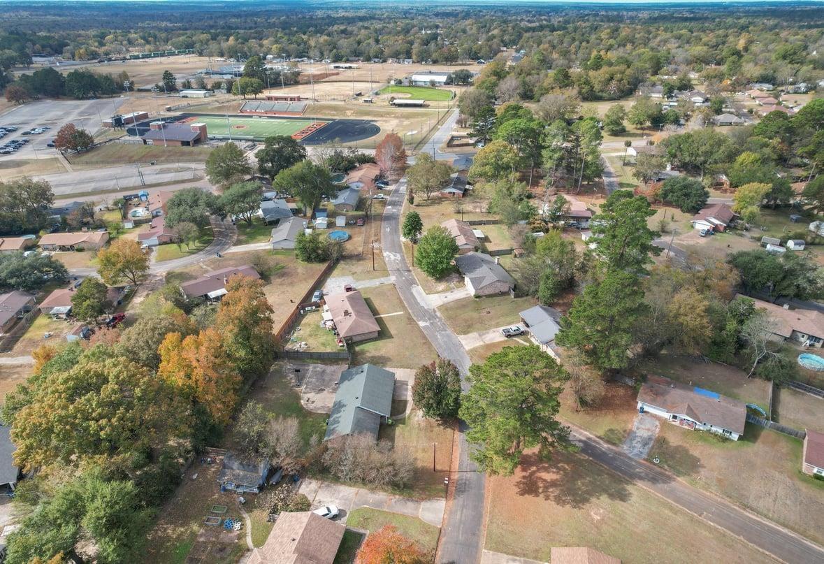 Image 3: Aerial view of property and surrounding area featuring nearby suburban area, Aerial View