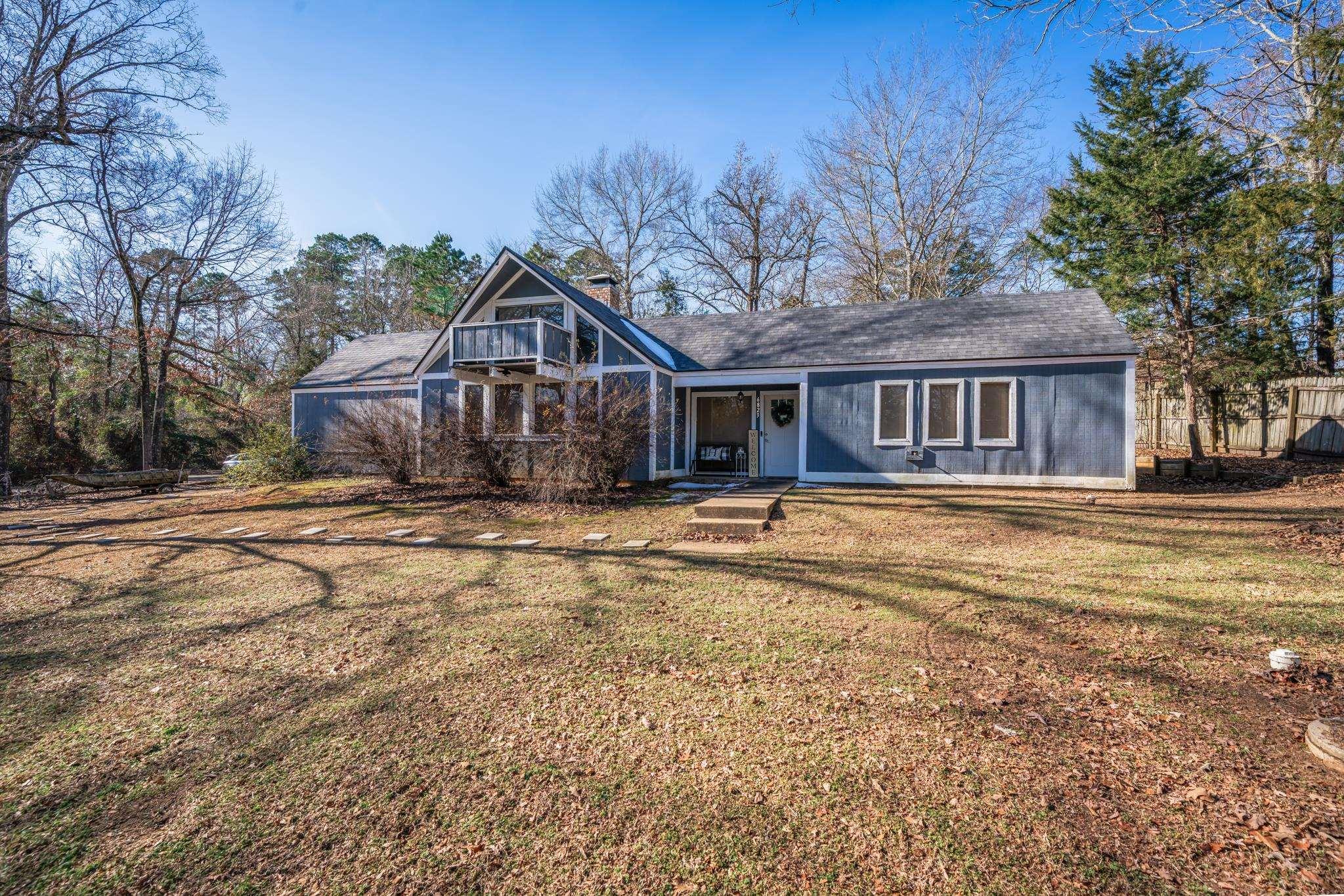 Image 0: View of front facade with a front yard, a chimney, a porch, and a shingled roof, Front Of Structure