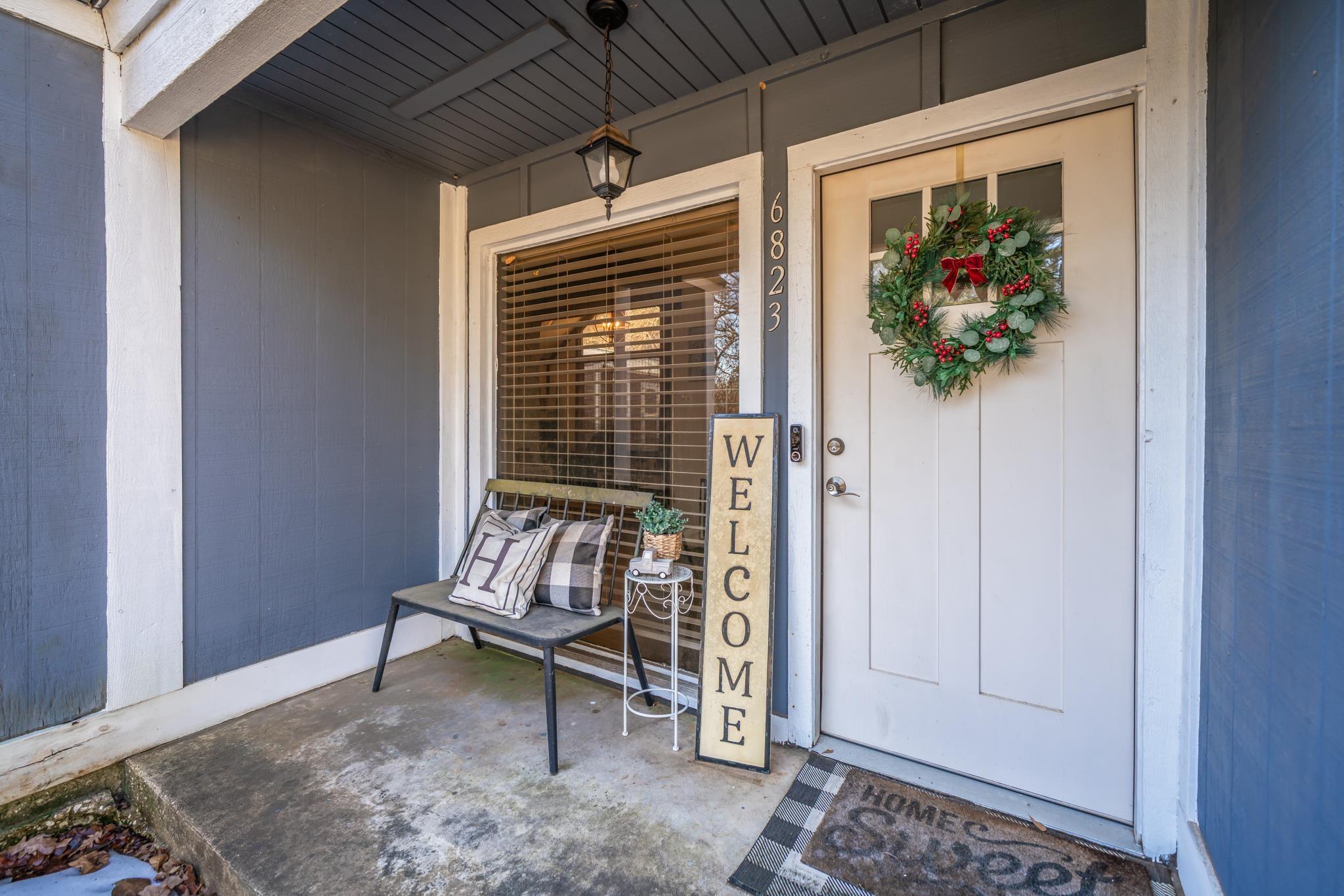 Image 2: Property entrance with covered porch, Entry