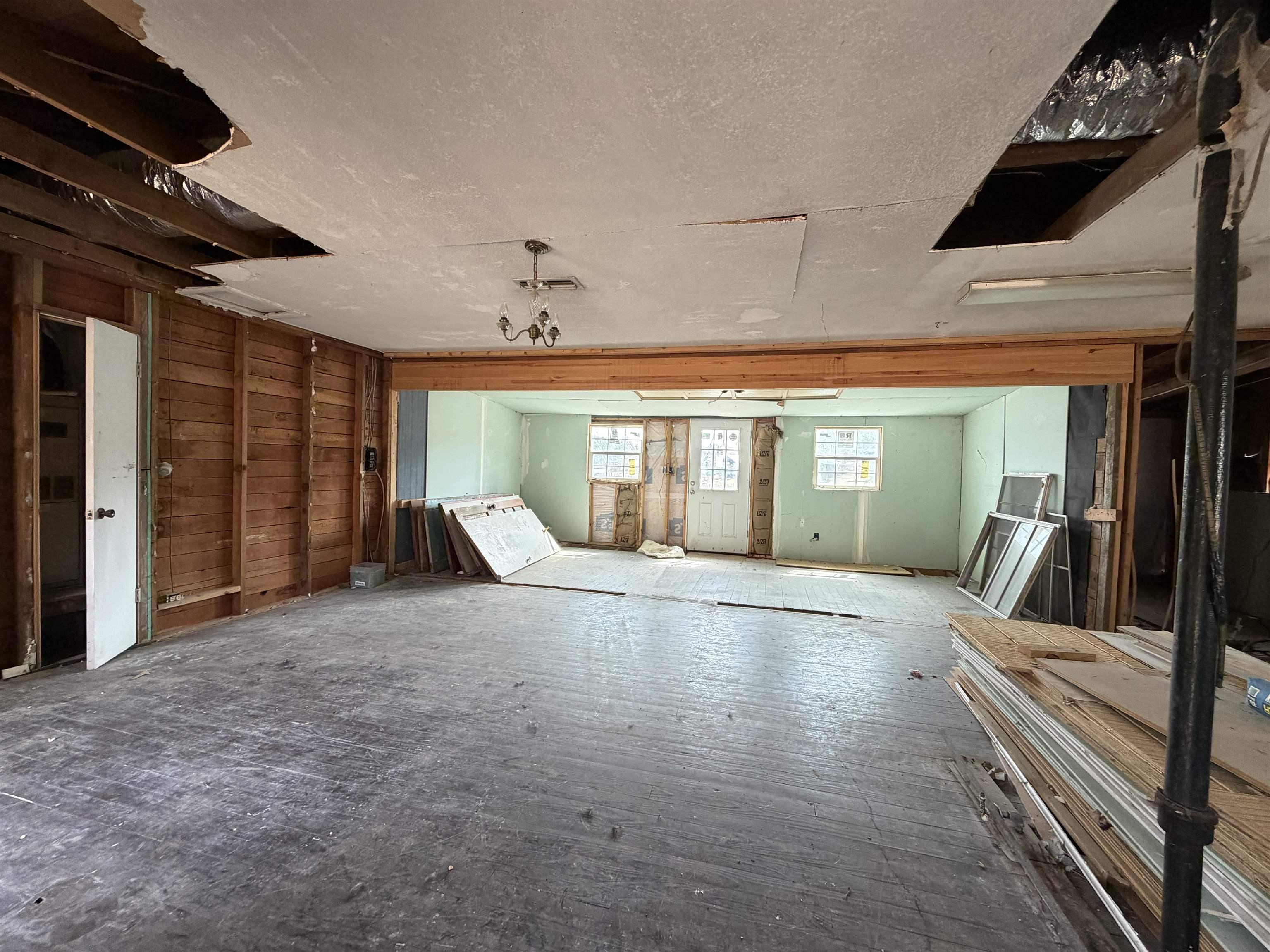 Image 3: Misc room featuring hardwood / wood-style flooring and a textured ceiling, Other
