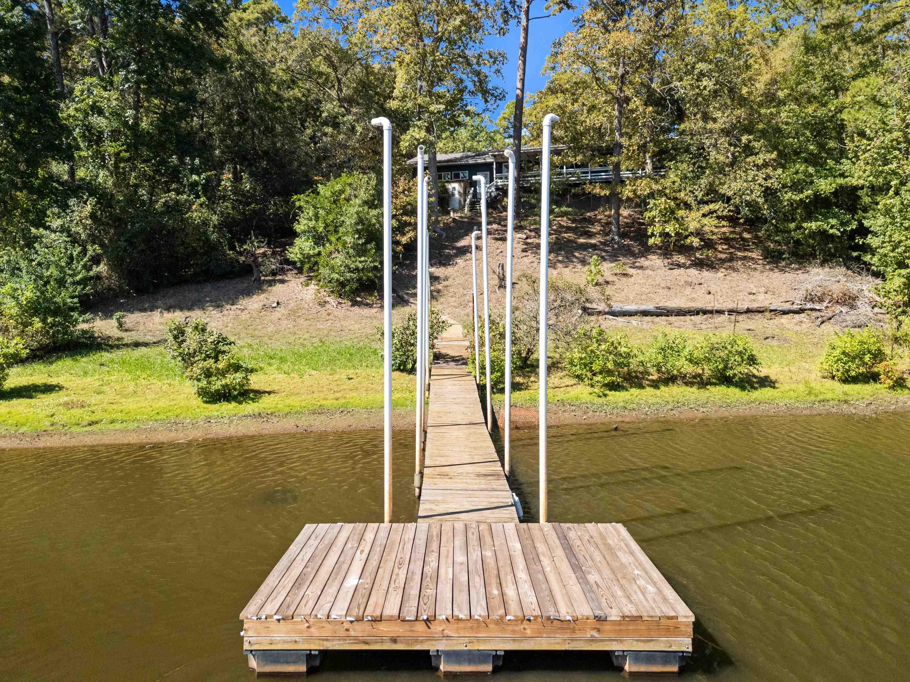 Image 3: Dock with a water view and view of scattered trees, Dock