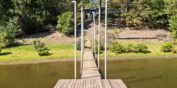 Image 3: Dock with a water view and view of scattered trees, Dock