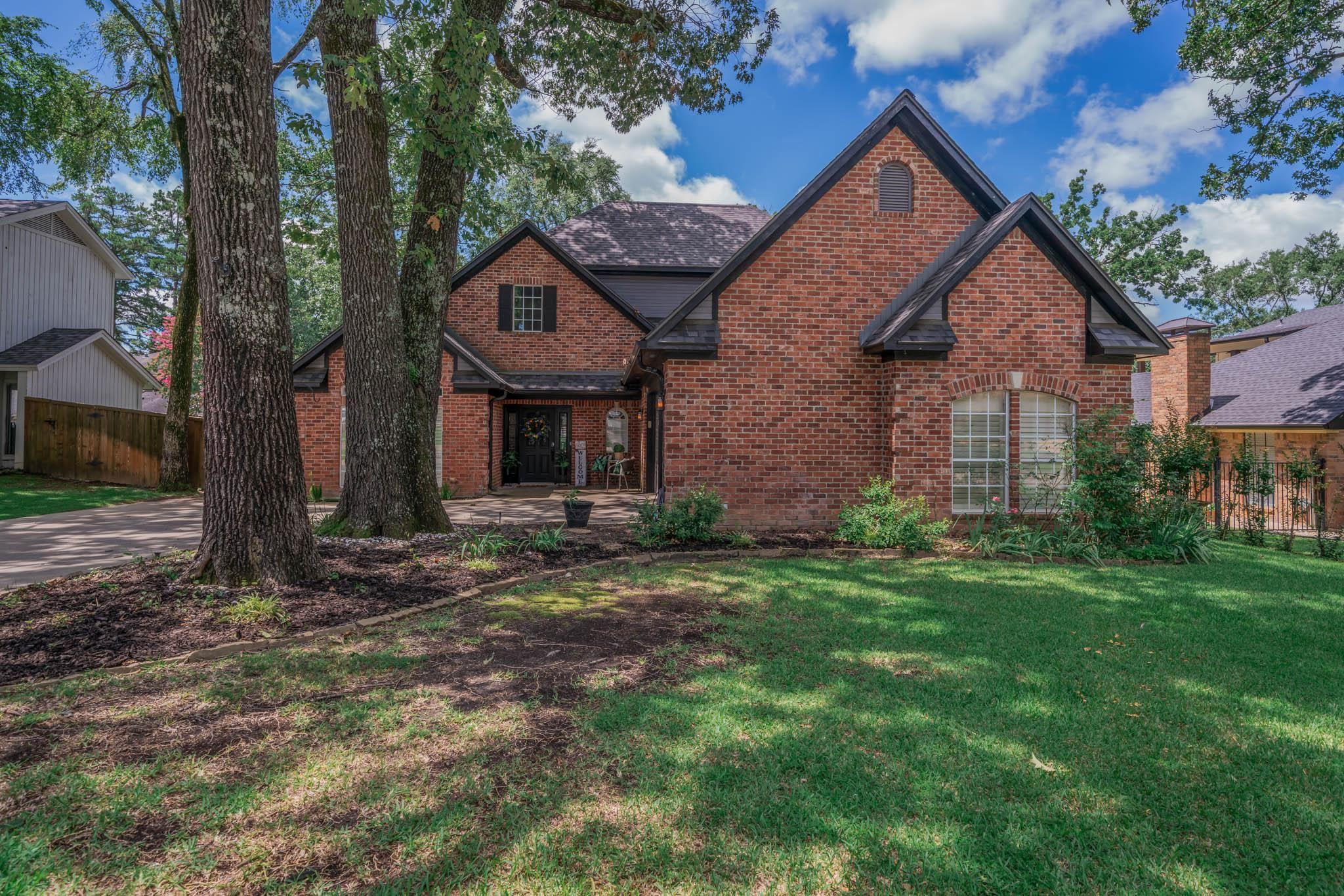 Image 1: View of front of home featuring brick siding, Front Of Structure