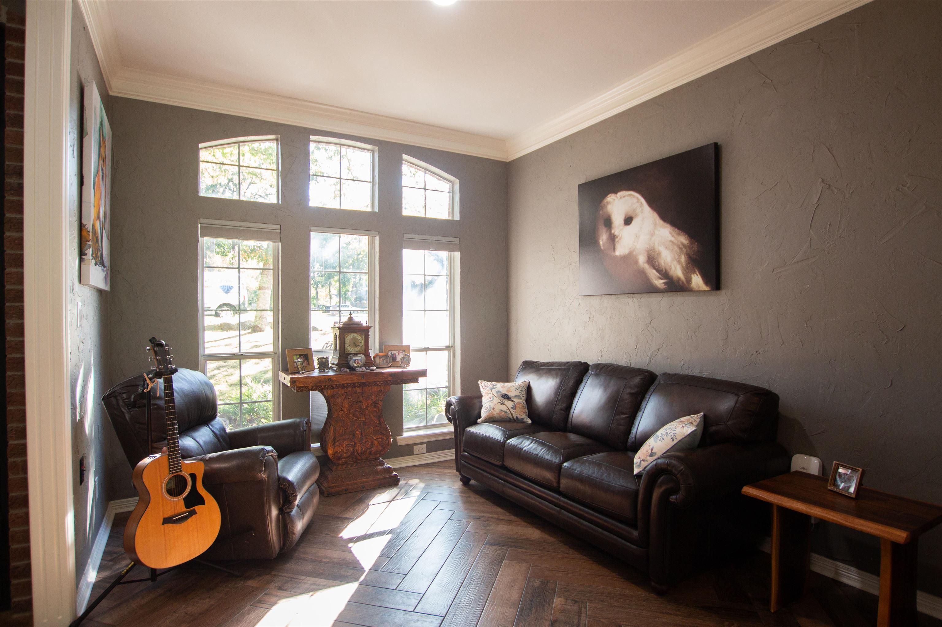 Image 3: Living room with a textured wall and ornamental molding, Living Room