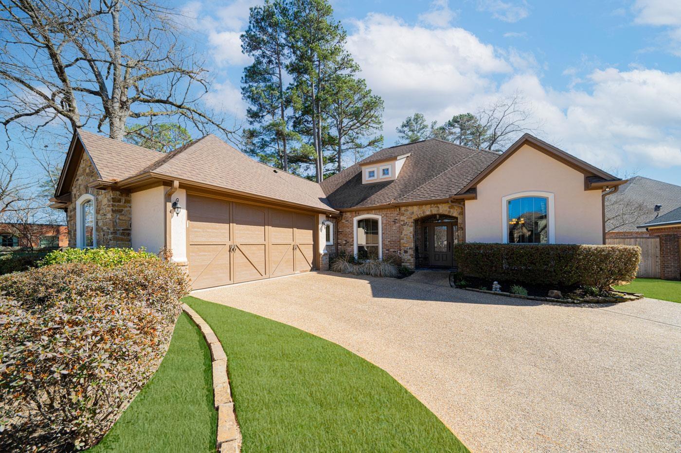 Image 2: French provincial home featuring a shingled roof, driveway, an attached garage, stone siding, and stucco siding, Front Of Structure