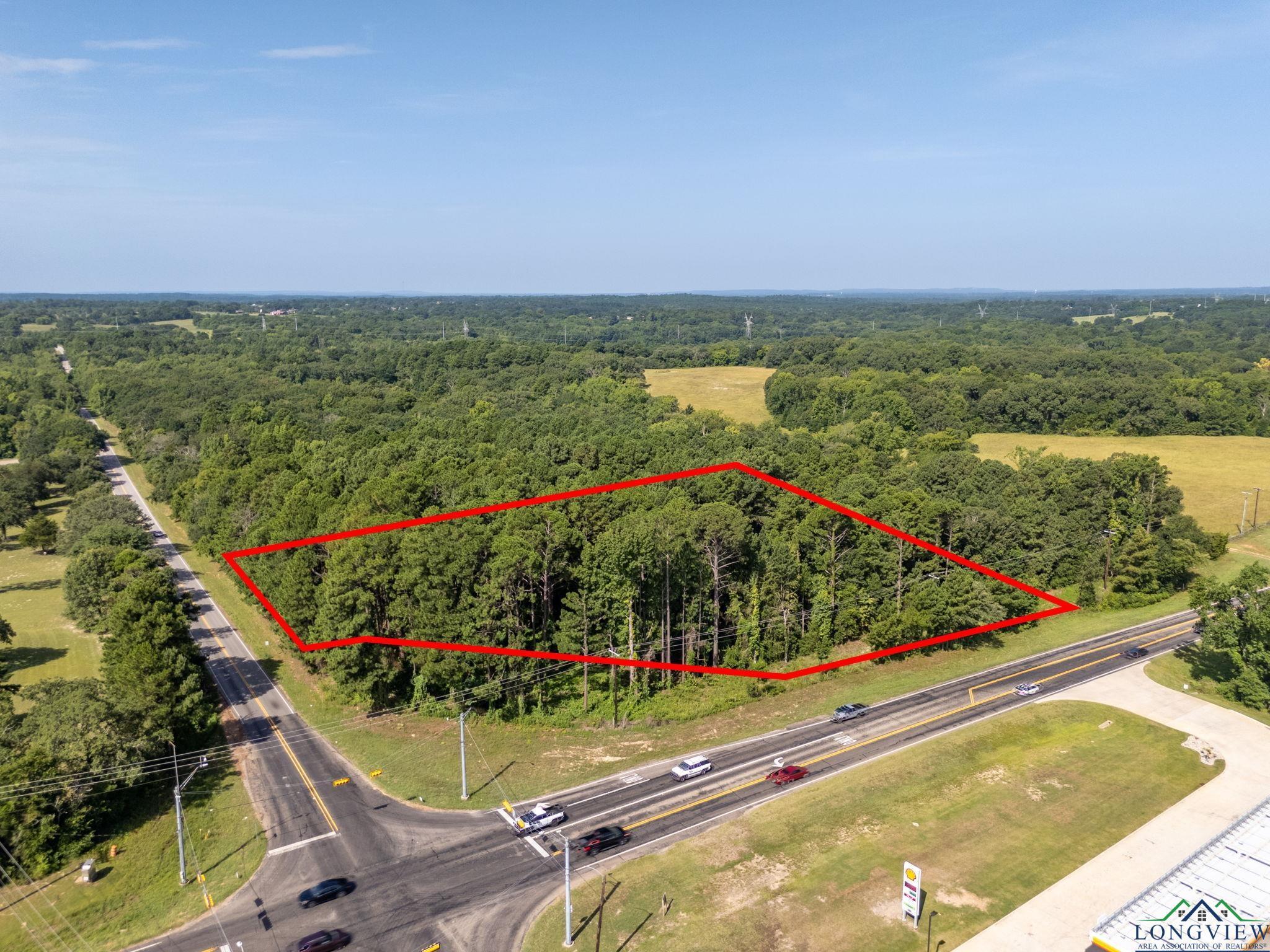 Image 0: Aerial view of property and surrounding area with property boundaries highlighted, Aerial View