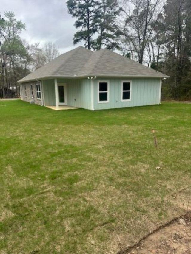 Image 1: Back of property with a patio area and a lawn, Back Of Structure
