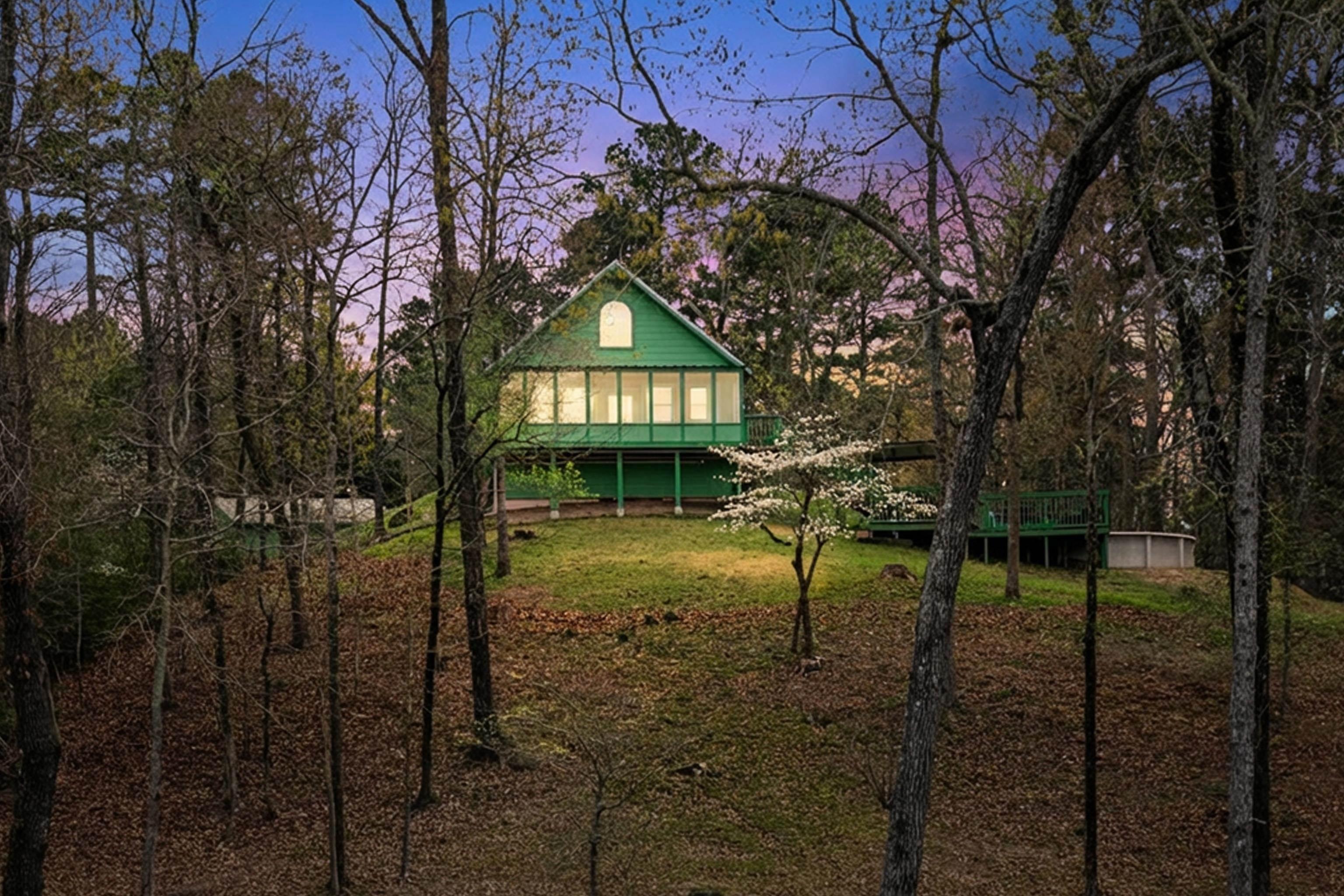 Image 0: Rear view of house featuring a yard, Back Of Structure