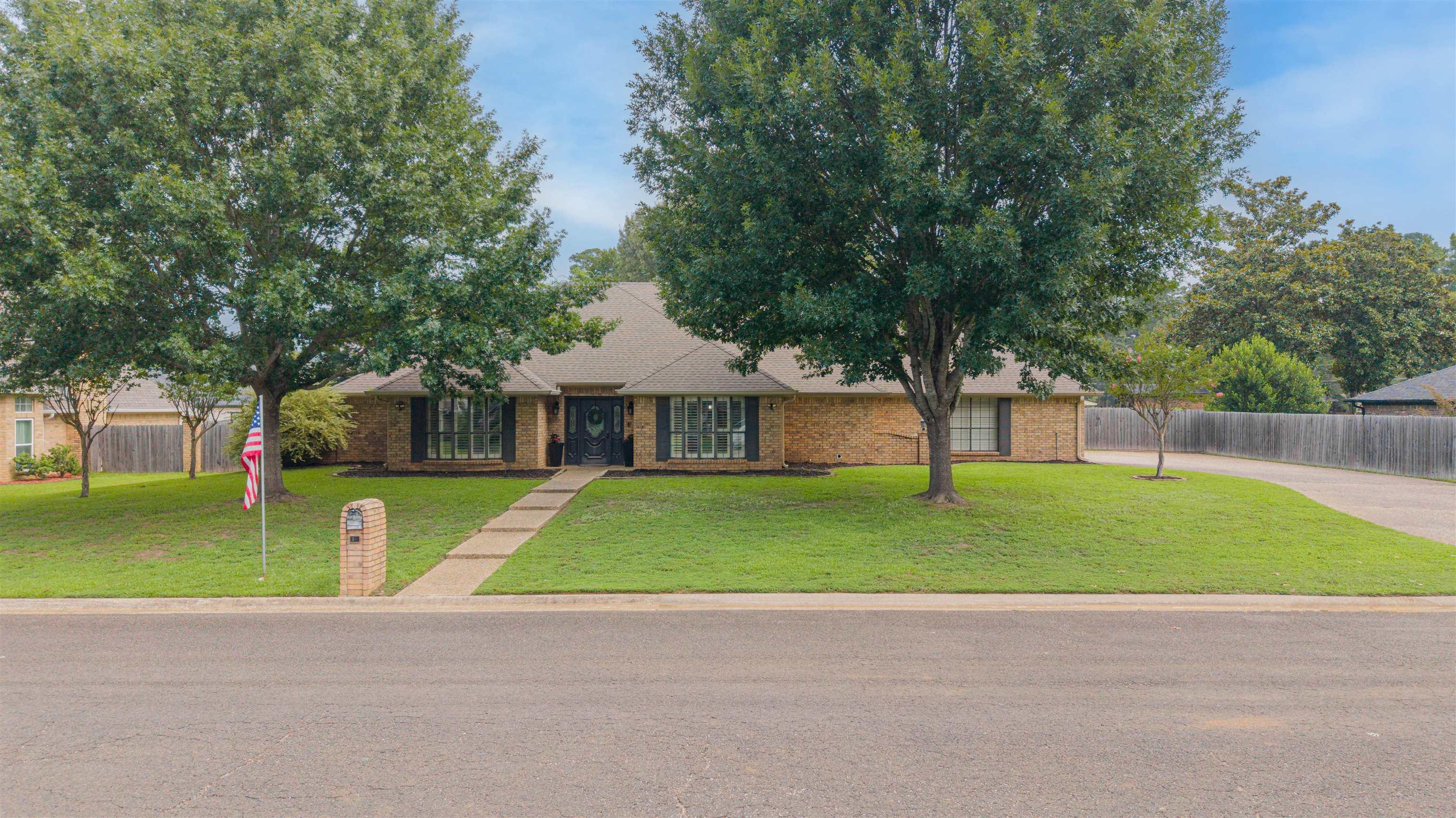 Image 1: Brick facade residence with a gabled roofline and dark shutters, Front Of Structure