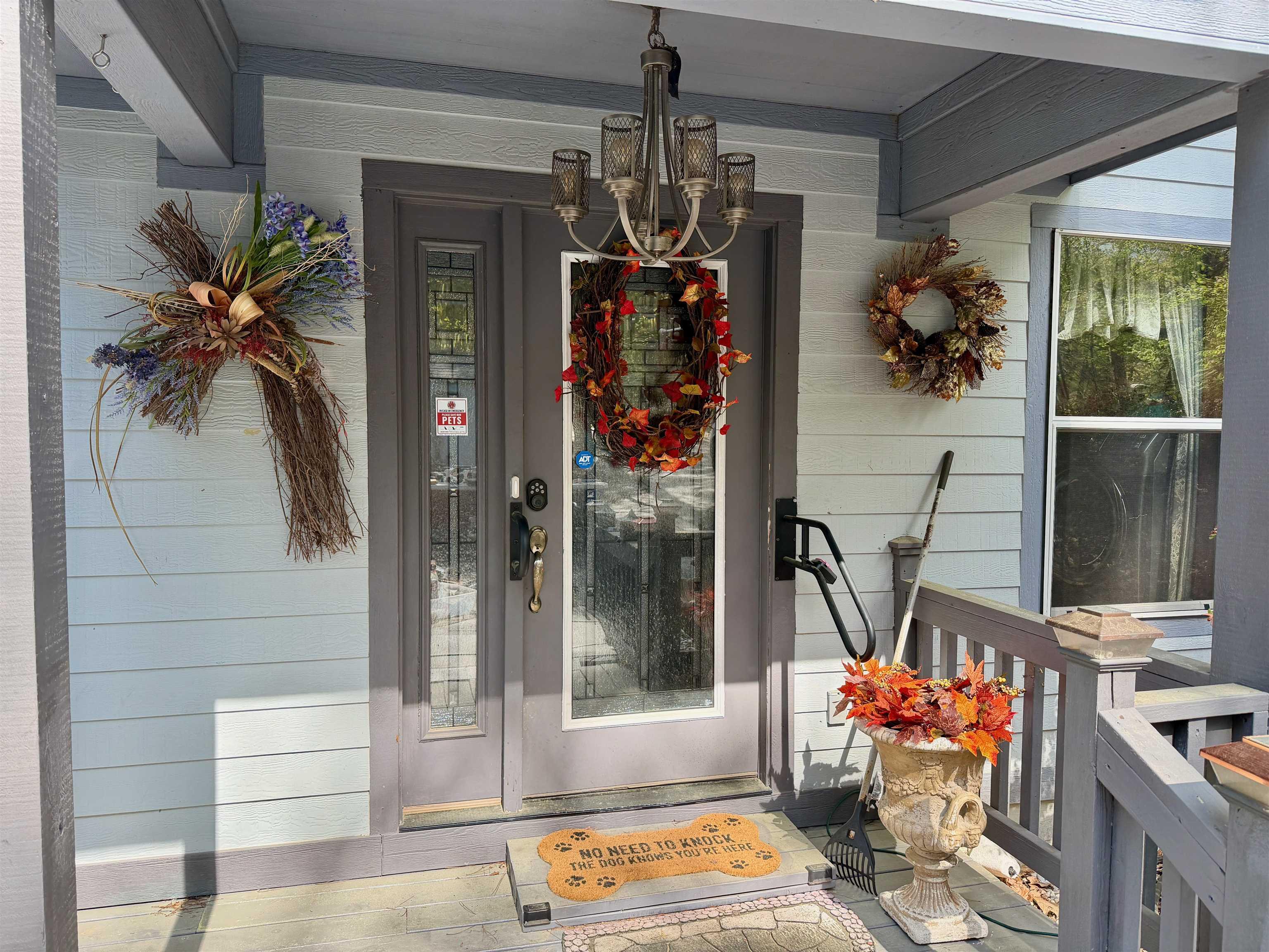 Image 2: Entrance to property featuring covered porch, Entry