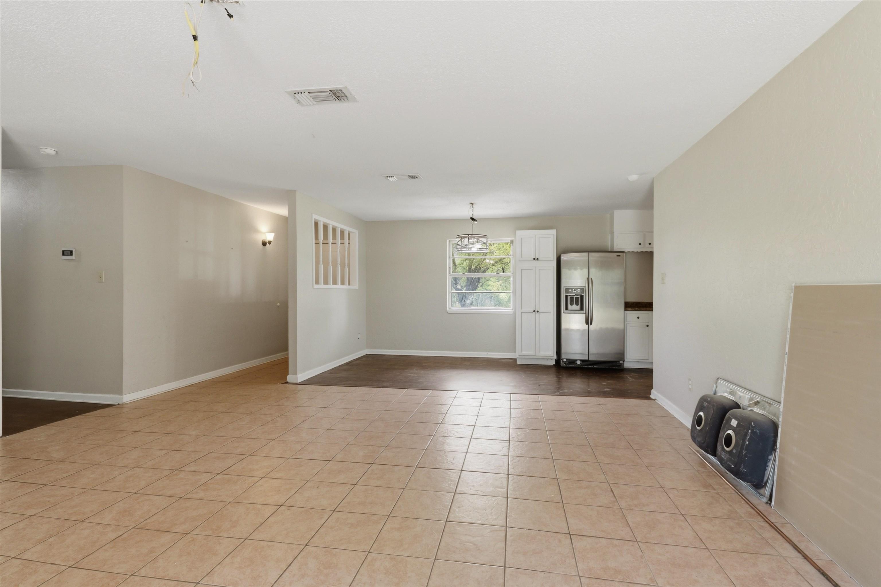 Image 3: Unfurnished living room featuring baseboards, Living Room
